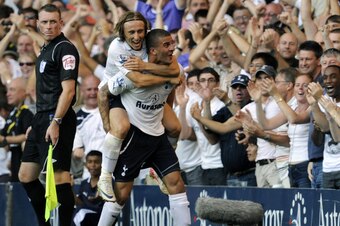 Walker celebrates scoring in a 2-1 win over Arsenal in 2011. One of the team's young players then, he is now one of Tottenham's longest-serving players.