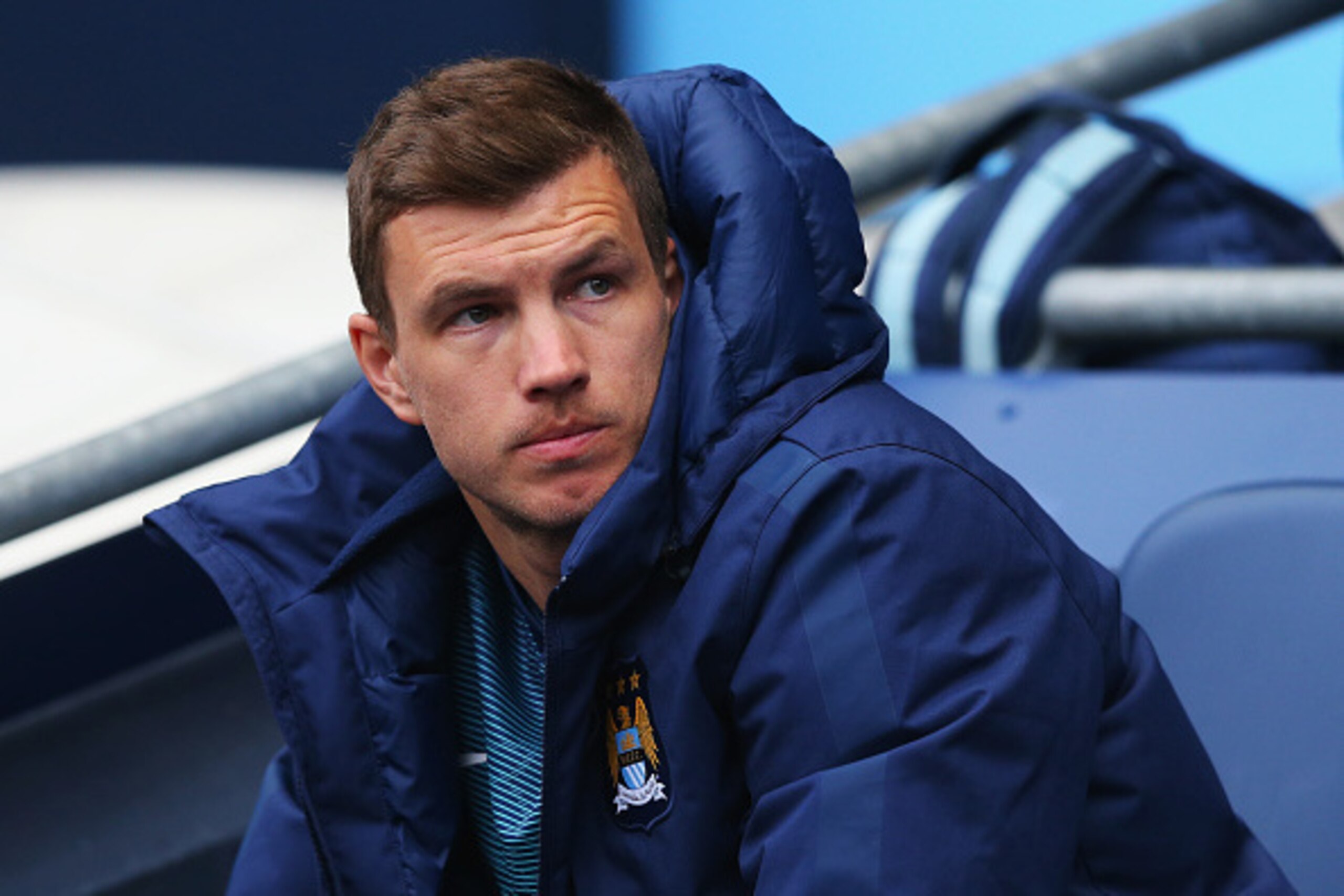 MANCHESTER, ENGLAND - APRIL 25: Edin Dzeko of Manchester City looks on from the bench during the Barclays Premier League match between Manchester City and Aston Villa at Etihad Stadium on April 25, 2015 in Manchester, England.  (Photo by Alex Livesey/Gett