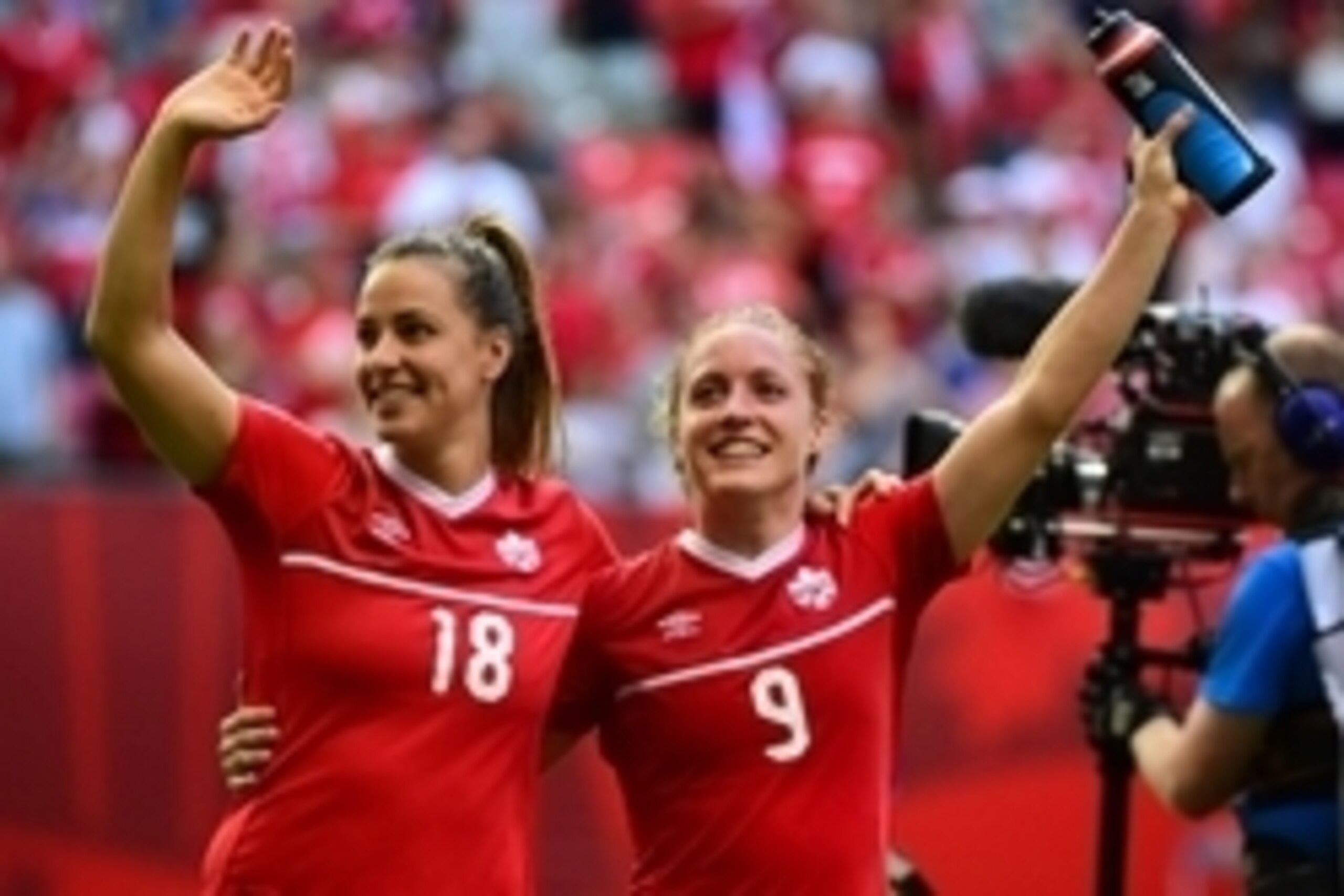 Jun 21, 2015; Vancouver, British Columbia, CAN; Canada midfielder Selenia Iacchelli (18) and Canada defender Josee Belanger (9) wave to fans at the end of their 1-0 victory over Switzerland in the round of sixteen in the FIFA 2015 women's World Cup soccer Jun 21, 2015; Vancouver, British Columbia, CAN; Canada midfielder Selenia Iacchelli (18) and Canada defender Josee Belanger (9) wave to fans at the end of their 1-0 victory over Switzerland in the round of sixteen in the FIFA 2015 women's World Cup soccer