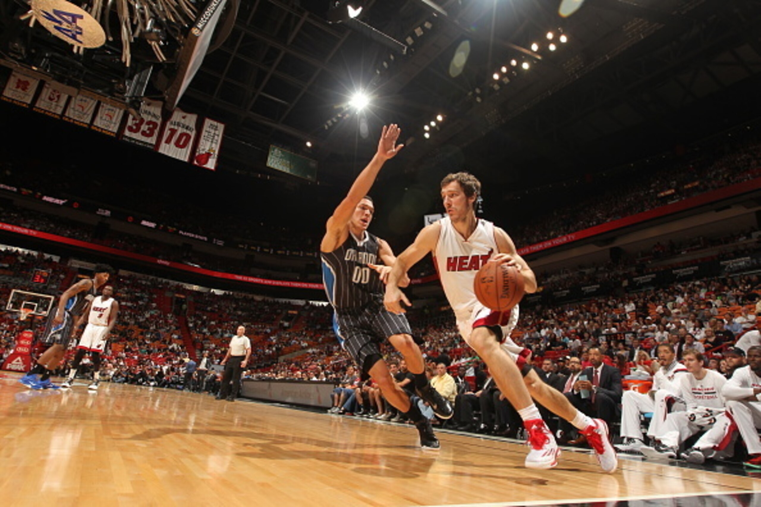 MIAMI, FL - APRIL 13: Goran Dragic #7 of the Miami Heat drives to the basket against Aaron Gordon #00 of the Orlando Magic on April 13, 2015 at American Airlines Arena in Miami, Florida. NOTE TO USER: User expressly acknowledges and agrees that, by down MIAMI, FL - APRIL 13: Goran Dragic #7 of the Miami Heat drives to the basket against Aaron Gordon #00 of the Orlando Magic on April 13, 2015 at American Airlines Arena in Miami, Florida. NOTE TO USER: User expressly acknowledges and agrees that, by down
