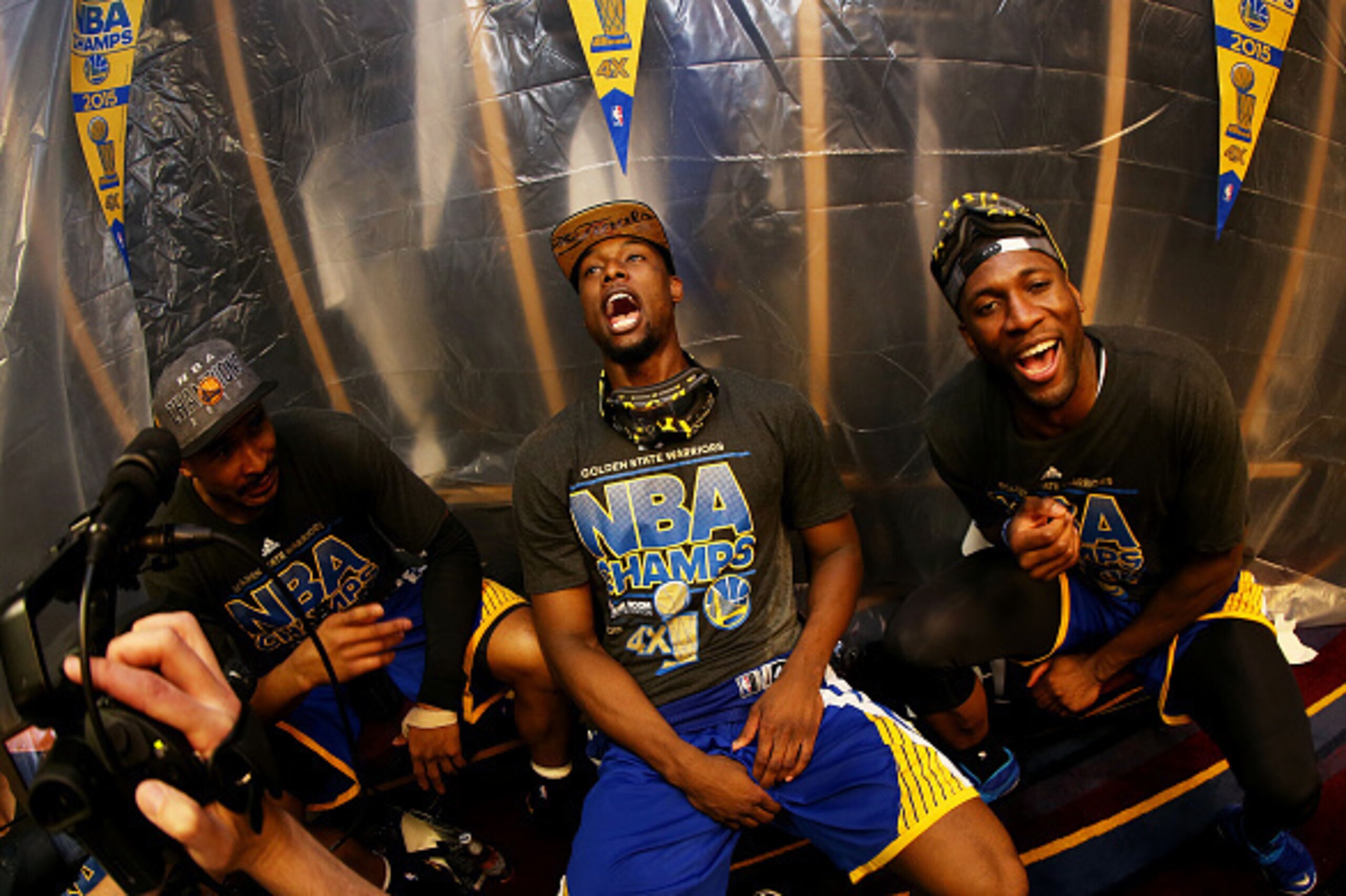 CLEVELAND, OH - JUNE 16:  Harrison Barnes #40 of the Golden State Warriors and teammates celebrate in the locker room after they defeated the Cleveland Cavaliers 105 to 97 in Game Six of the 2015 NBA Finals at Quicken Loans Arena on June 16, 2015 in Cleve