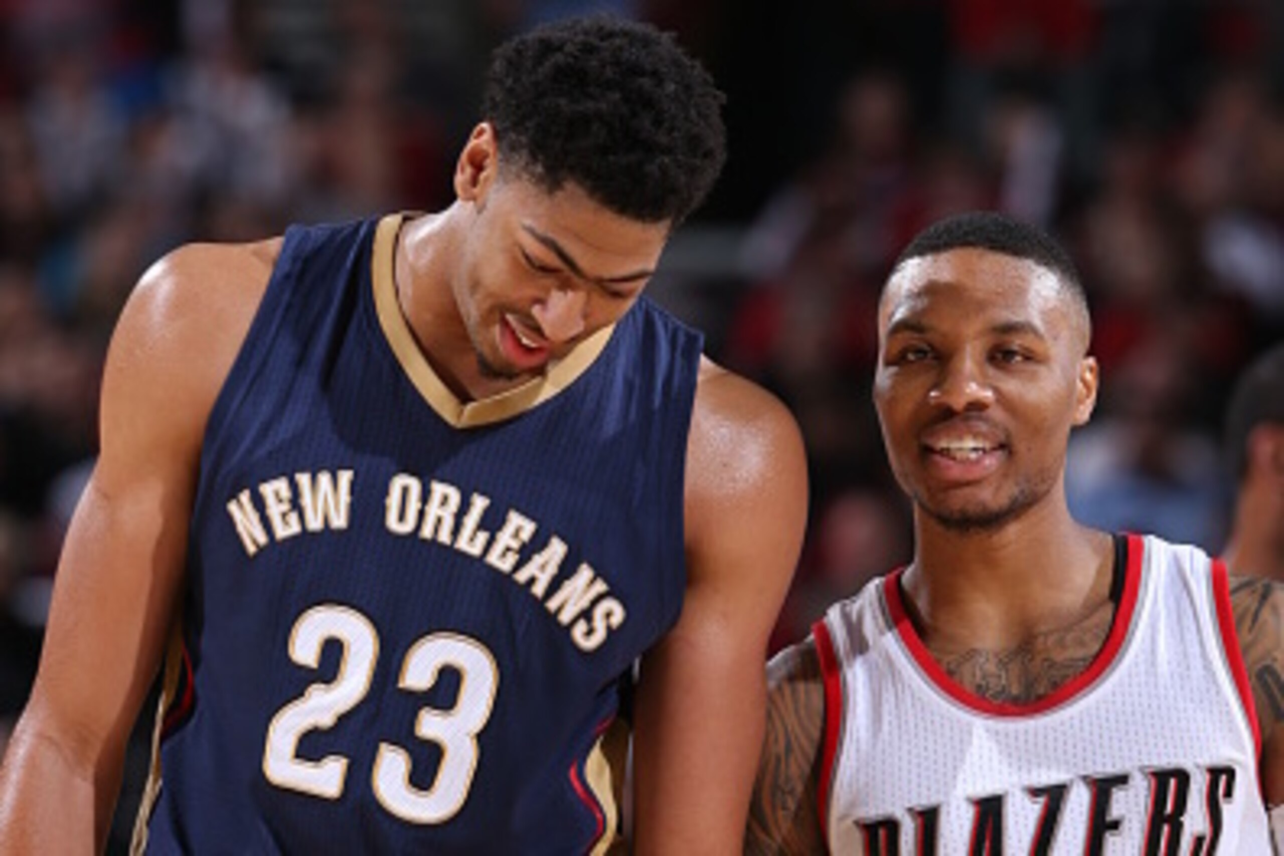 PORTLAND, OR - NOVEMBER 17: Anthony Davis #23 of the New Orleans Pelicans and Damian Lillard #0 of the Portland Trail Blazers speak during a game on November 17, 2014 at the Moda Center Arena in Portland, Oregon. NOTE TO USER: User expressly acknowledges 