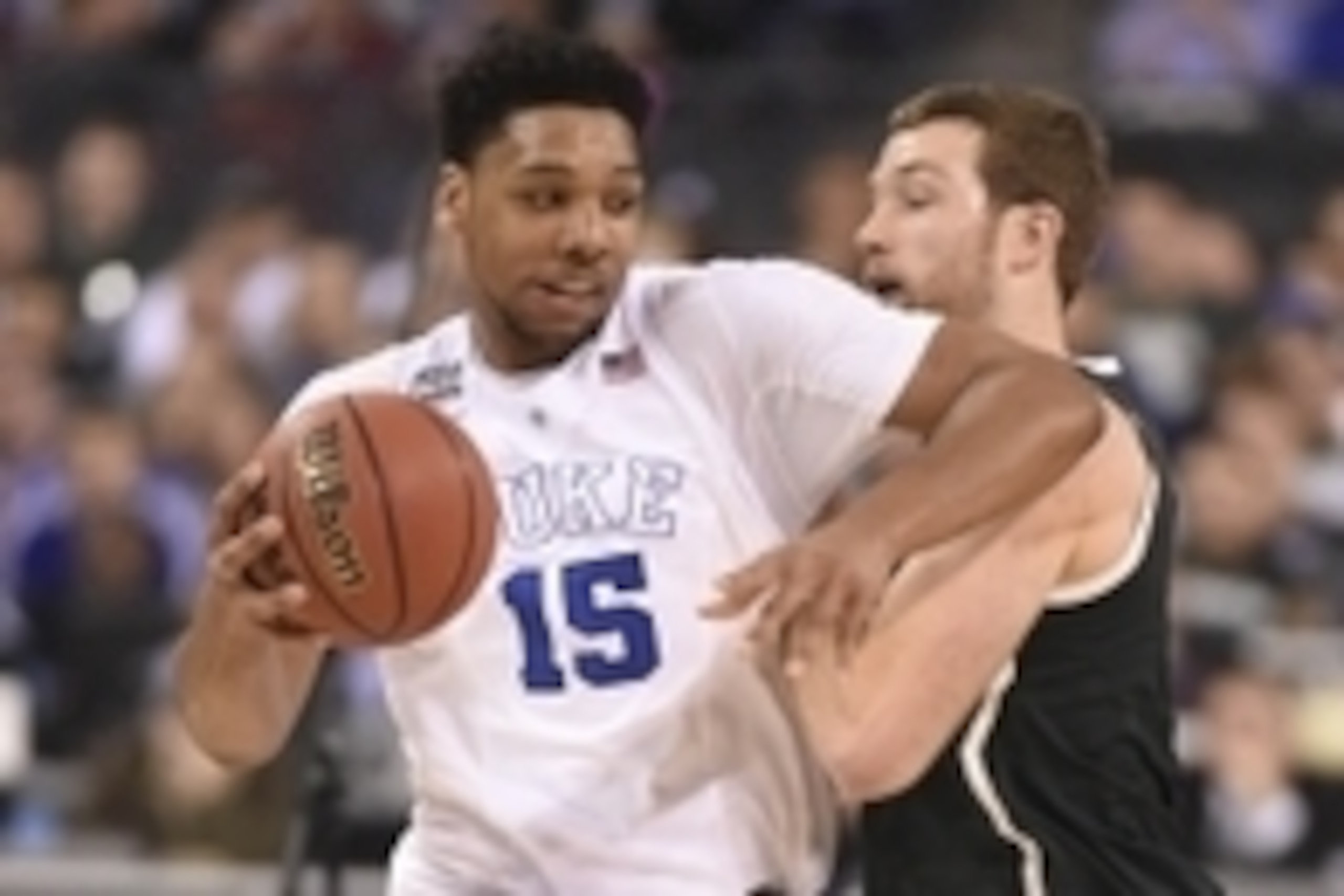 Apr 4, 2015; Indianapolis, IN, USA; Michigan State Spartans forward Matt Costello (10) defends Duke Blue Devils center Jahlil Okafor (15) in the first half of the 2015 NCAA Men's Division I Championship semi-final game at Lucas Oil Stadium. Mandatory Cred
