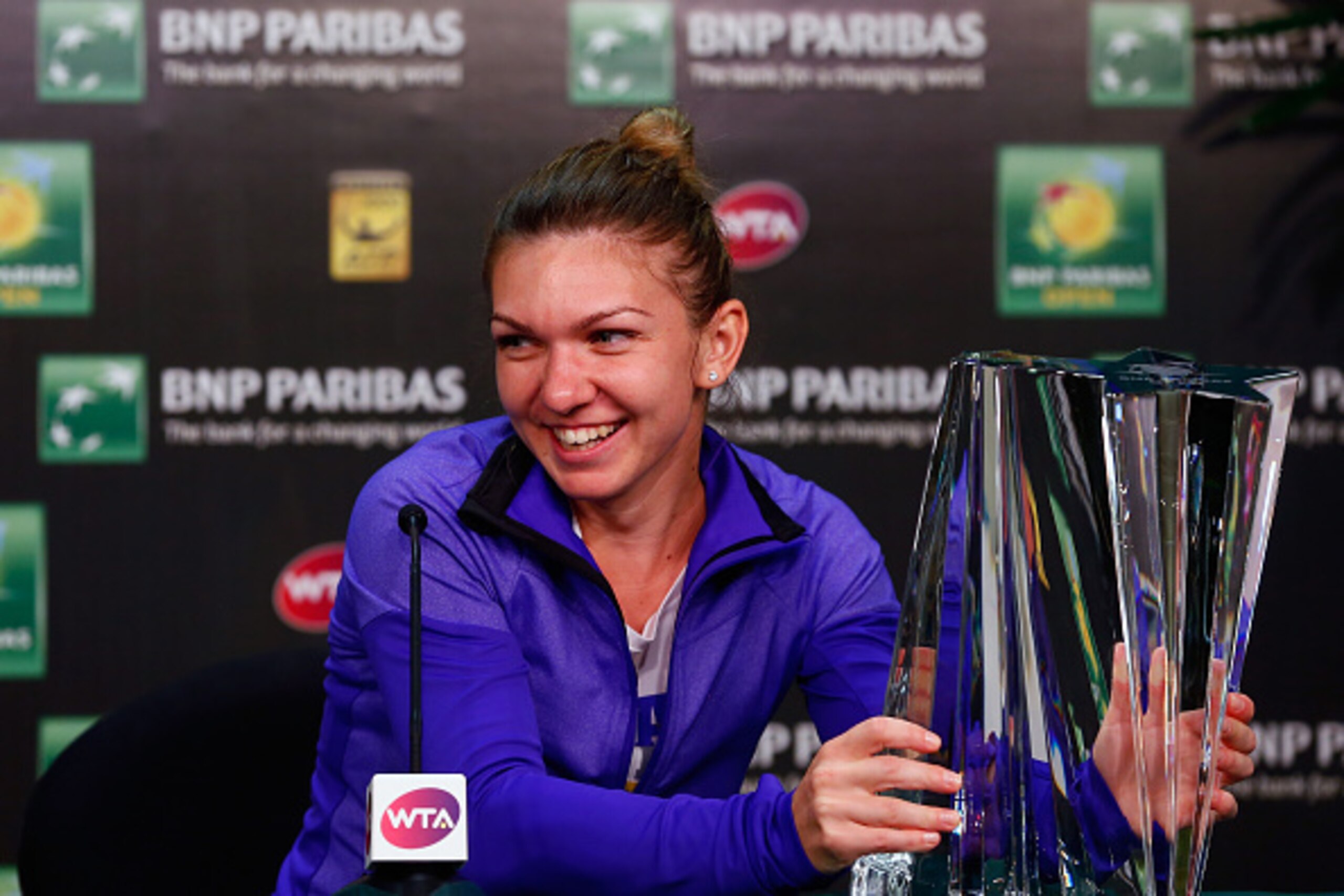 INDIAN WELLS, CA - MARCH 22:  Simona Halep of Romania with the winners trophy at a press conference after she defeated Jelena Jankovic of Serbia in the final during day fourteen of the BNP Paribas Open tennis at the Indian Wells Tennis Garden on March 22,