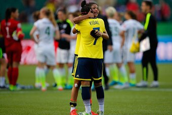 EDMONTON, AB - JUNE 22:  Carolina Arias #17 and Ingrid Vidal #7 of Colombia react after the 2-0 loss to the United States in the FIFA Women's World Cup 2015 Round of 16 match at Commonwealth Stadium on June 22, 2015 in Edmonton, Canada.  (Photo by Kevin C