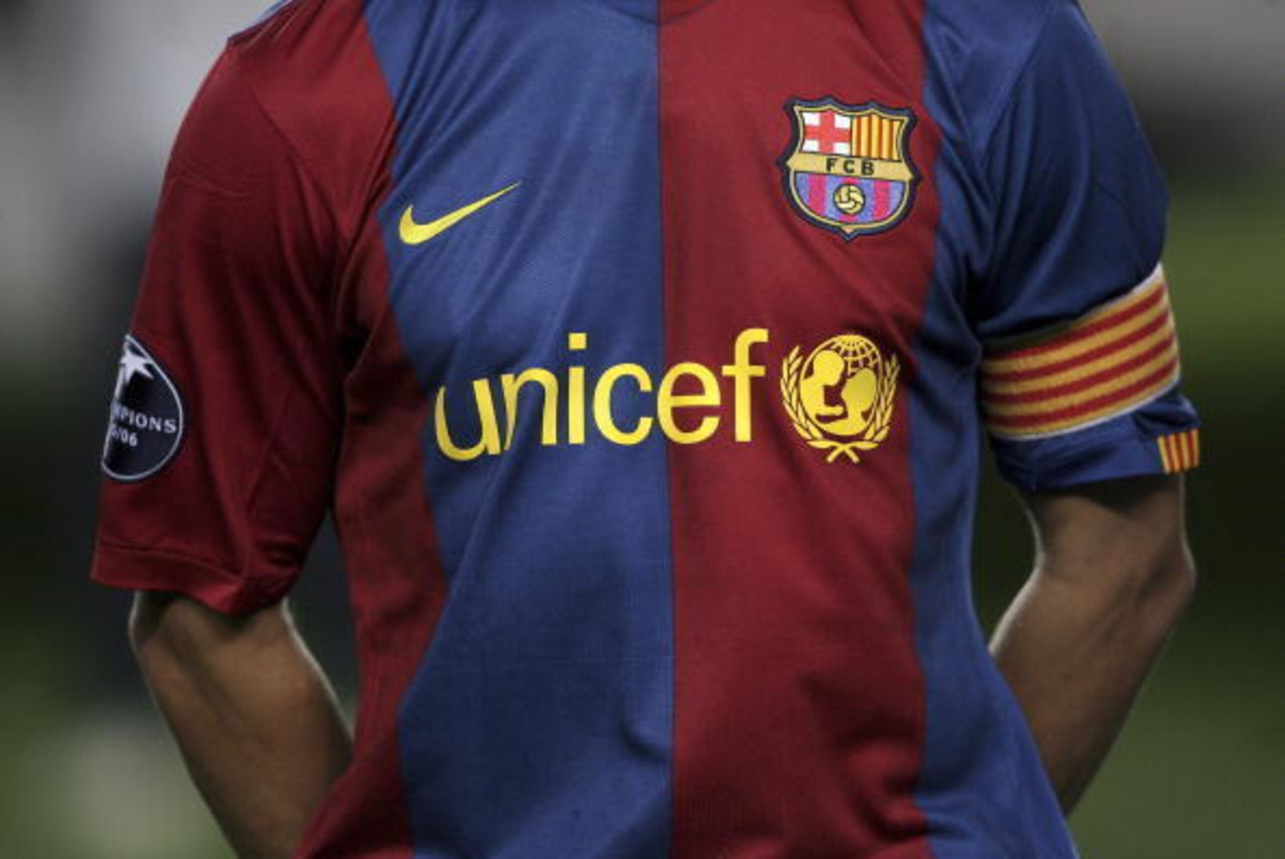 BARCELONA, SPAIN - SEPTEMBER 12:  The Barcelona captain Carles Puyol in the team line up before the game with their new 'UNICEF' shirt during the UEFA Champions League Group A match between Barcelona and Levski Sofia at The Nou Camp Stadium on September 1