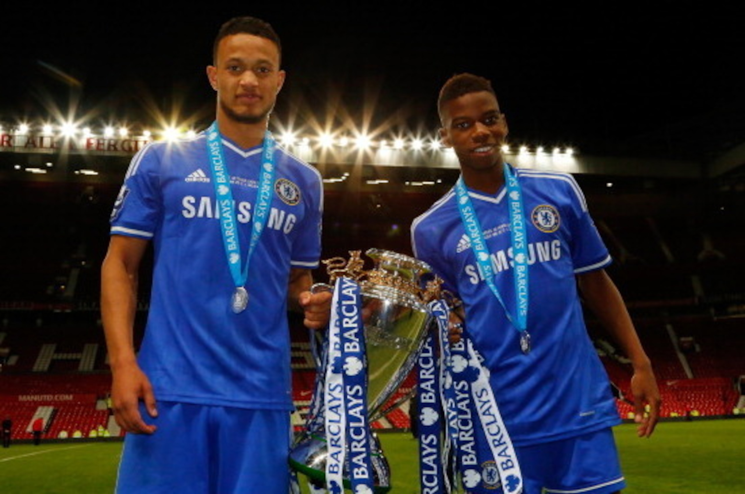 MANCHESTER, ENGLAND - MAY 14: Goal scorers Lewis Baker (L) and Charly Musonda of Chelsea celebrate with the trophy after the Barclays Under-21 Premier League Final match between Manchester United and Chelsea at Old Trafford on May 14, 2014 in England, Eng