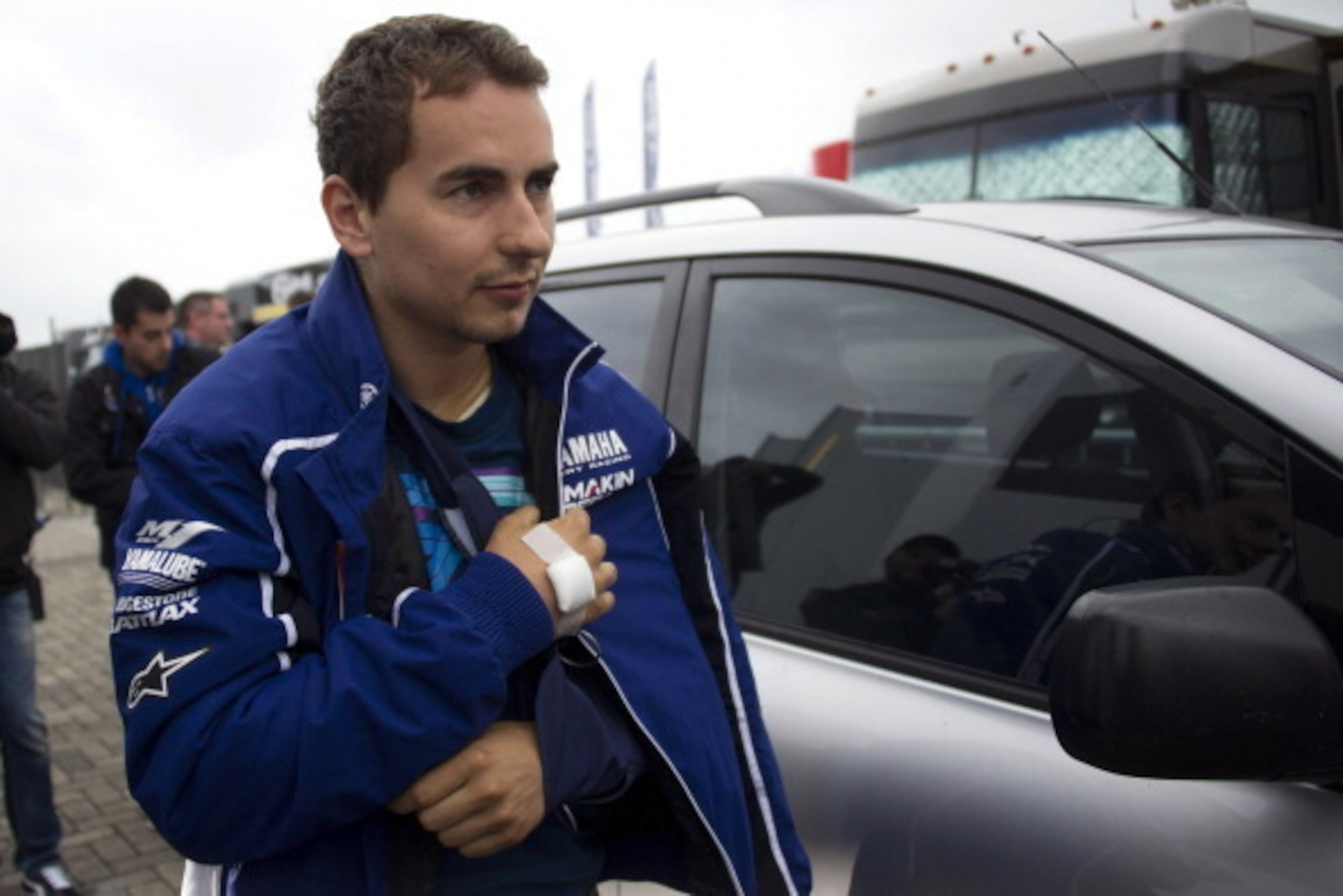 ASSEN, NETHERLANDS - JUNE 28: Jorge Lorenzo of Spain and Yamaha Factory Racing returns to paddock after an operation on his collarbone, which he broke during yesterday's free practice session, during the MotoGp Of Holland - Qualifying at TT Circuit Assen 