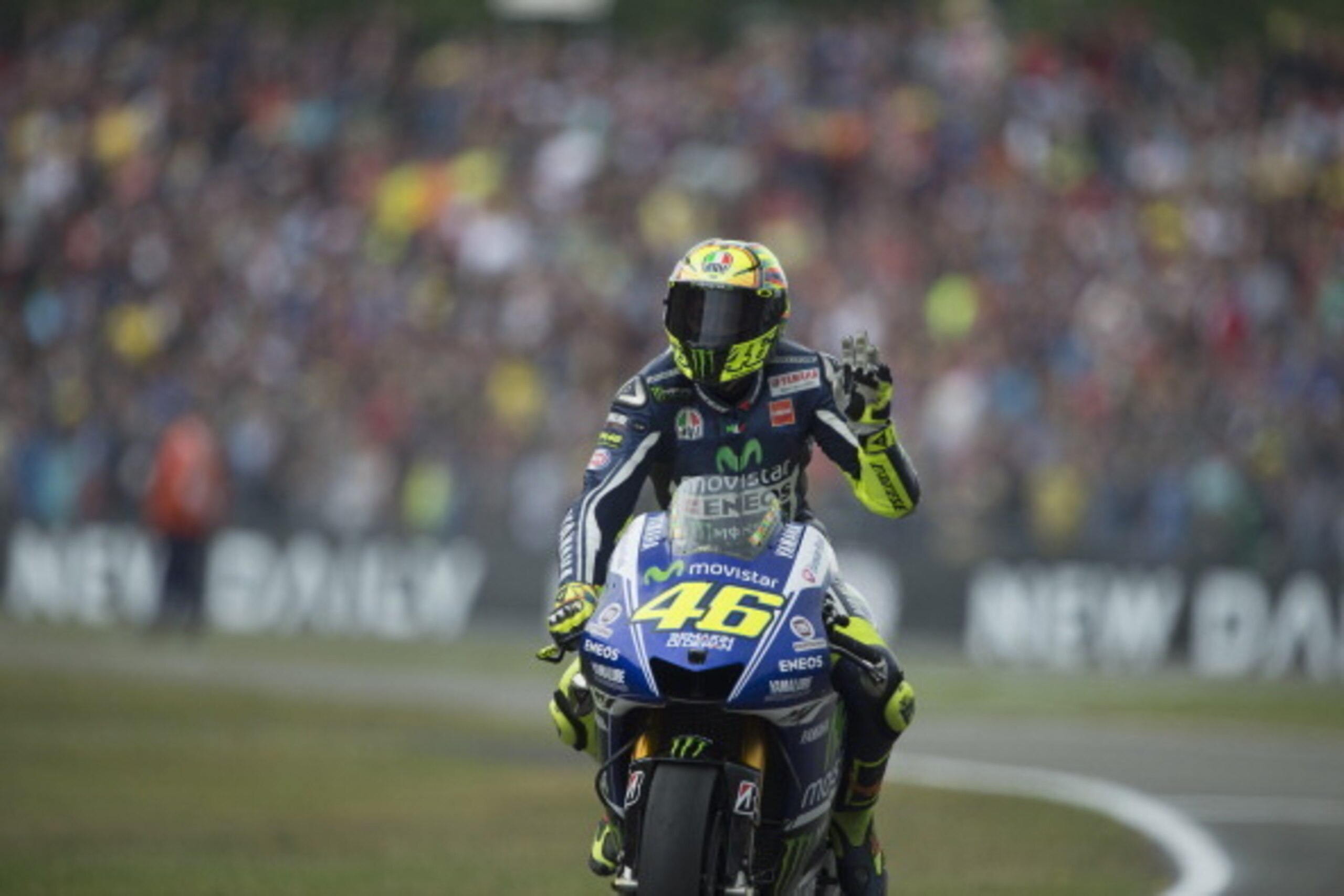 ASSEN, NETHERLANDS - JUNE 28:   Valentino Rossi of Italy and Movistar Yamaha MotoGP greets the fans at the end of the MotoGp race during the MotoGP of Netherlands - Race at  on June 28, 2014 in Assen, Netherlands.  (Photo by Mirco Lazzari gp/Getty Images)