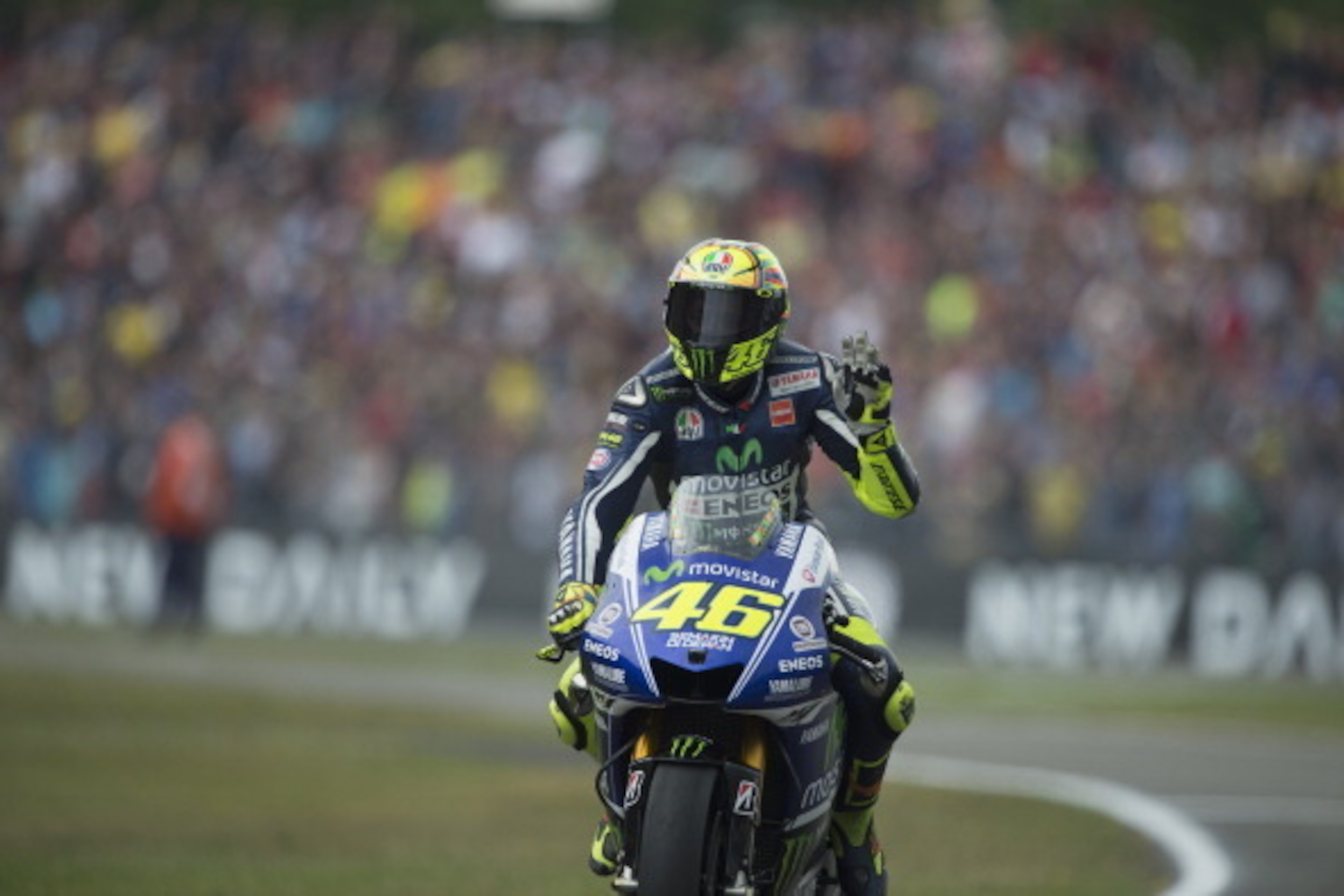 ASSEN, NETHERLANDS - JUNE 28:   Valentino Rossi of Italy and Movistar Yamaha MotoGP greets the fans at the end of the MotoGp race during the MotoGP of Netherlands - Race at  on June 28, 2014 in Assen, Netherlands.  (Photo by Mirco Lazzari gp/Getty Images)