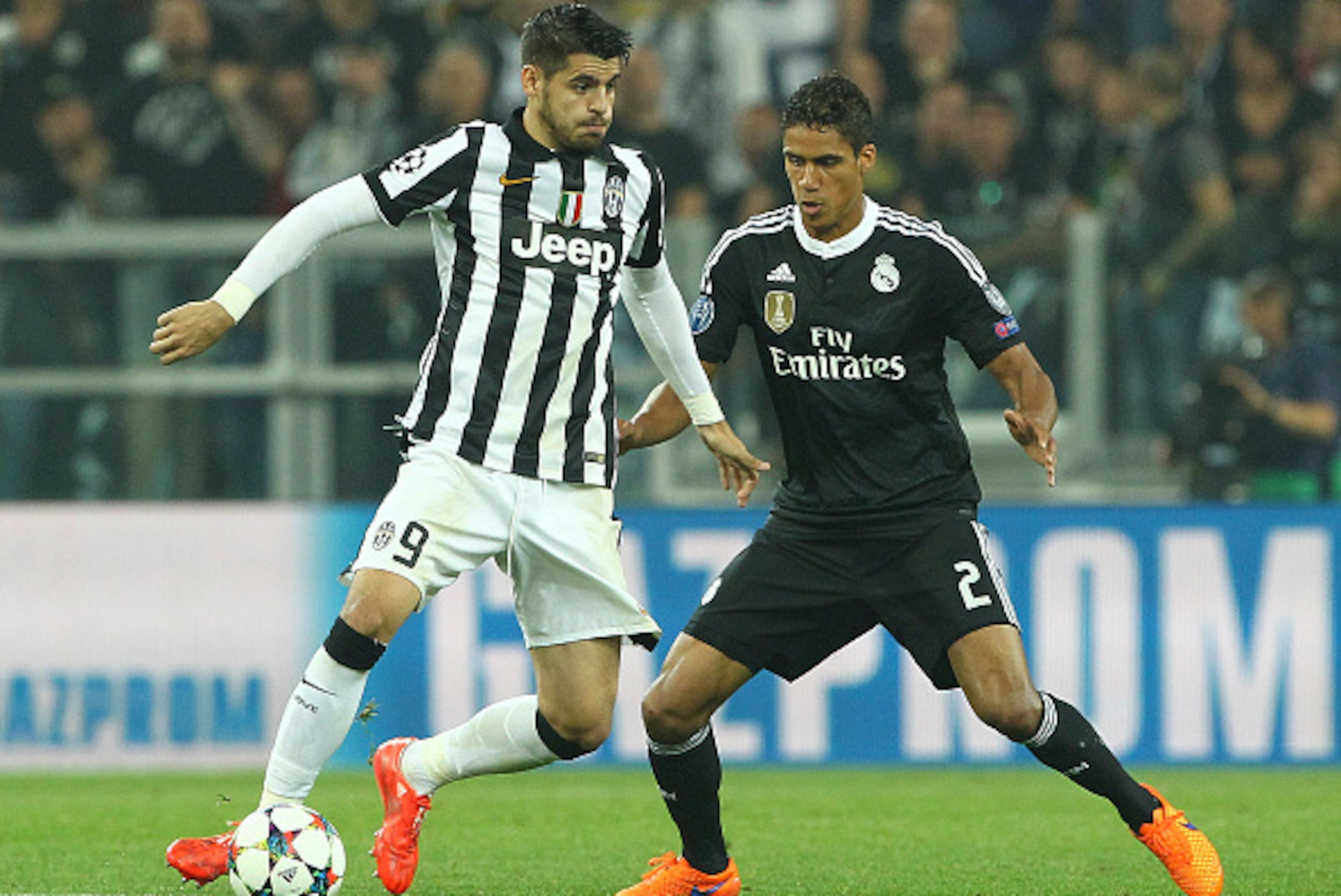 TURIN, ITALY - MAY 05:  Alvaro Morata of Juventus FC competes for the ball with Raphael Varane of Real Madrid CF during the UEFA Champions League semi final match between Juventus and Real Madrid CF at Juventus Arena on May 5, 2015 in Turin, Italy.  (Phot