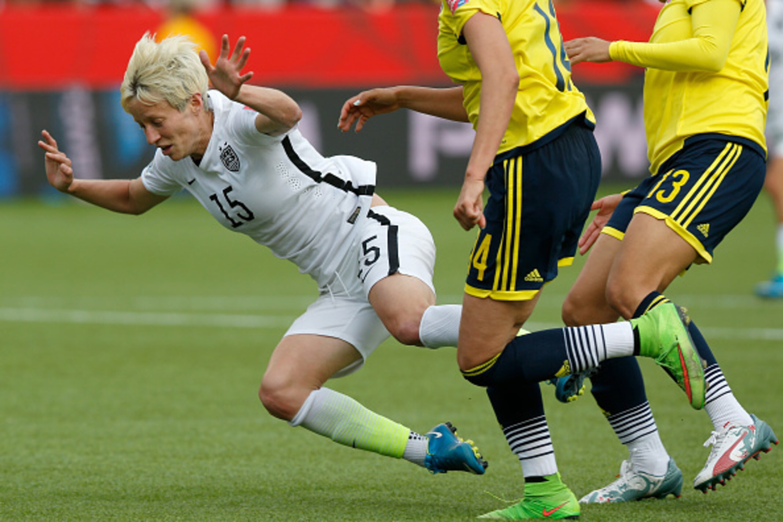 EDMONTON, AB - JUNE 22:  Megan Rapinoe #15 of the United States is taken down as a penalty kick is awarded in the second half against Colombia in the FIFA Women's World Cup 2015 Round of 16 match at Commonwealth Stadium on June 22, 2015 in Edmonton, Canad
