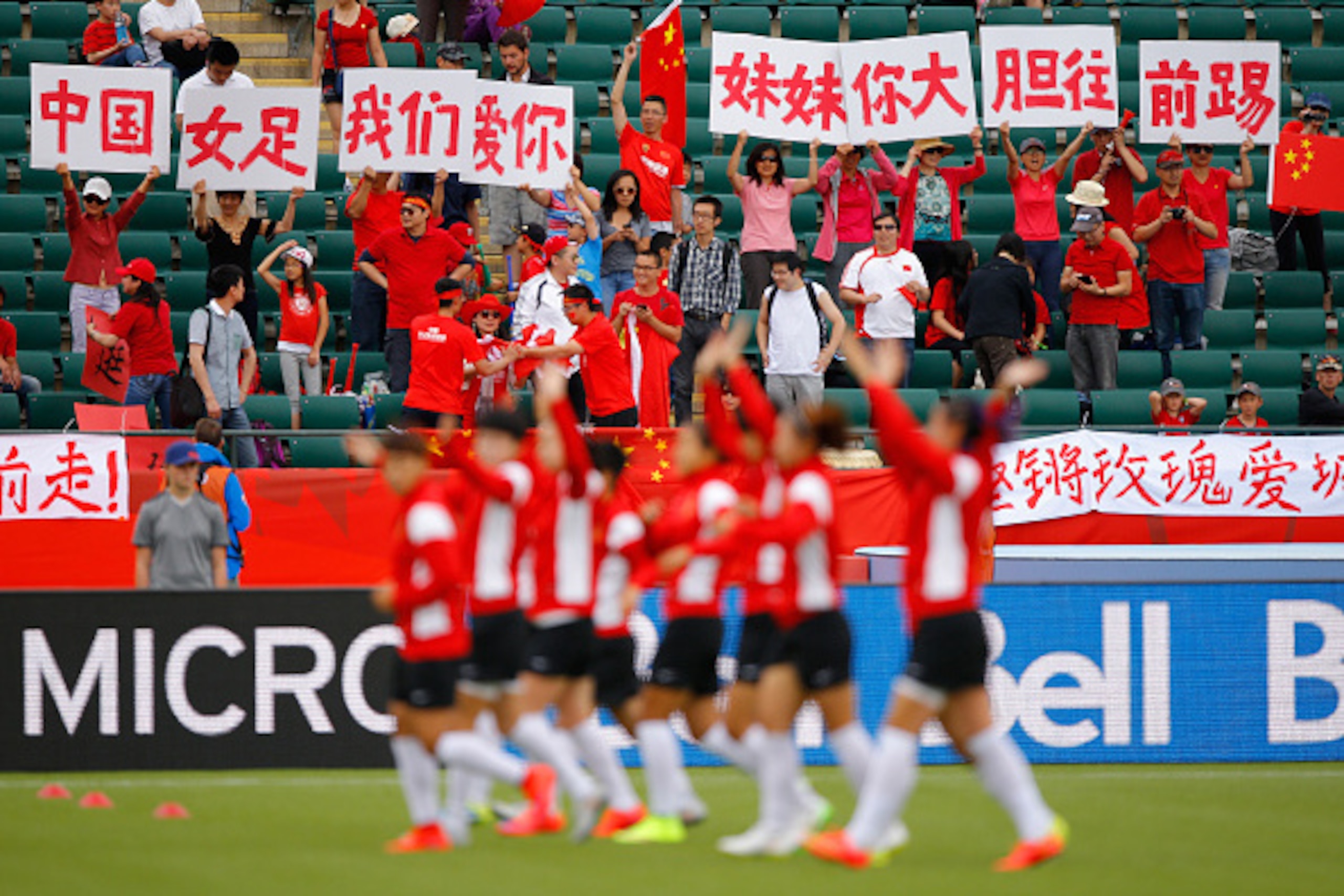 EDMONTON, AB - JUNE 20:  Fans of China PR cheer prior to the FIFA Women's World Canada 2015 Round of 16 match between China PR and Cameroon at Commonwealth Stadium on June 20, 2015 in Edmonton, Canada.  (Photo by Kevin C. Cox/Getty Images)