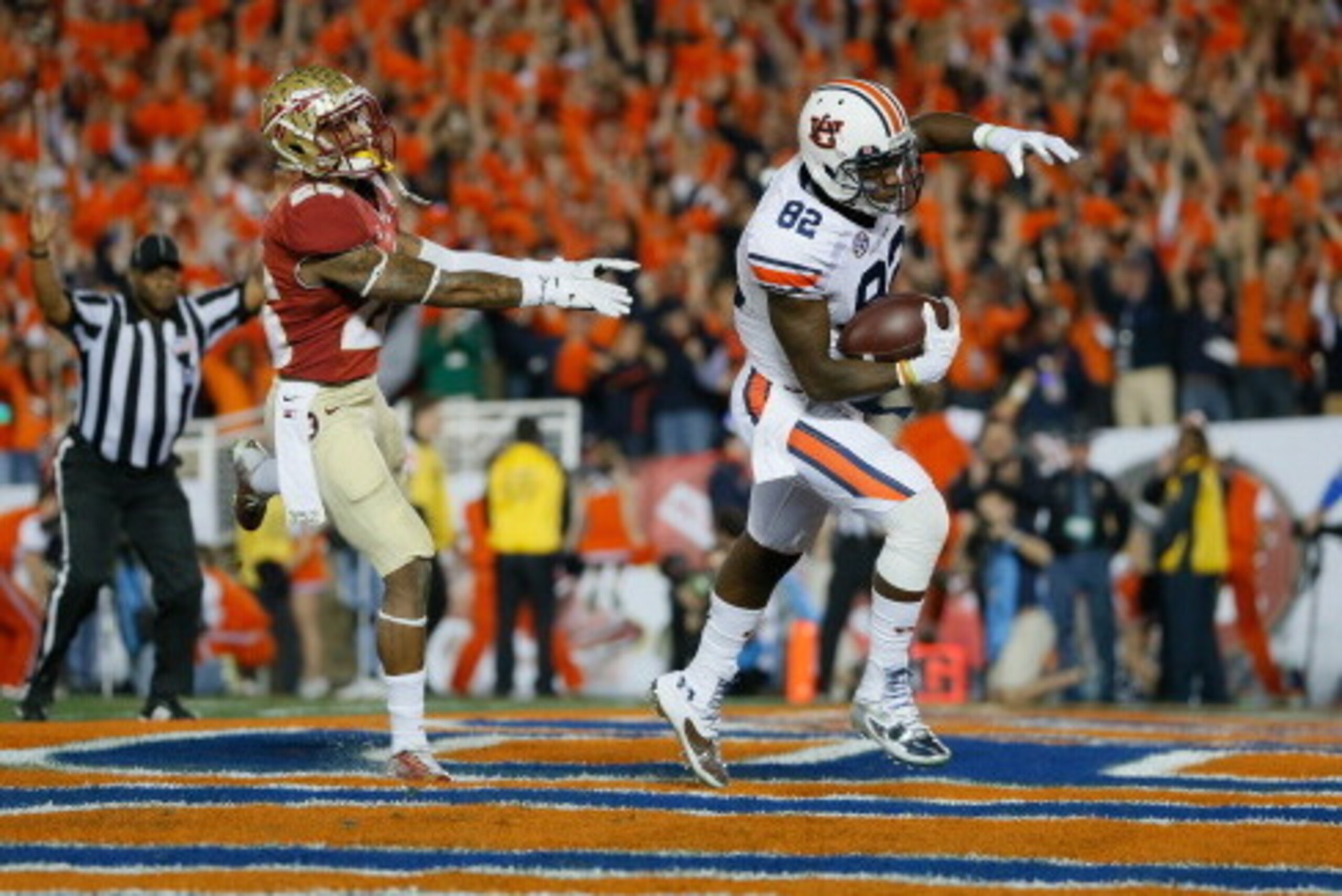 PASADENA, CA - JANUARY 06:  Wide receiver Melvin Ray #82 of the Auburn Tigers scores on a 50-yard touchdown pass against the Florida State Seminoles in the second quarter of the 2014 Vizio BCS National Championship Game at the Rose Bowl on January 6, 2014