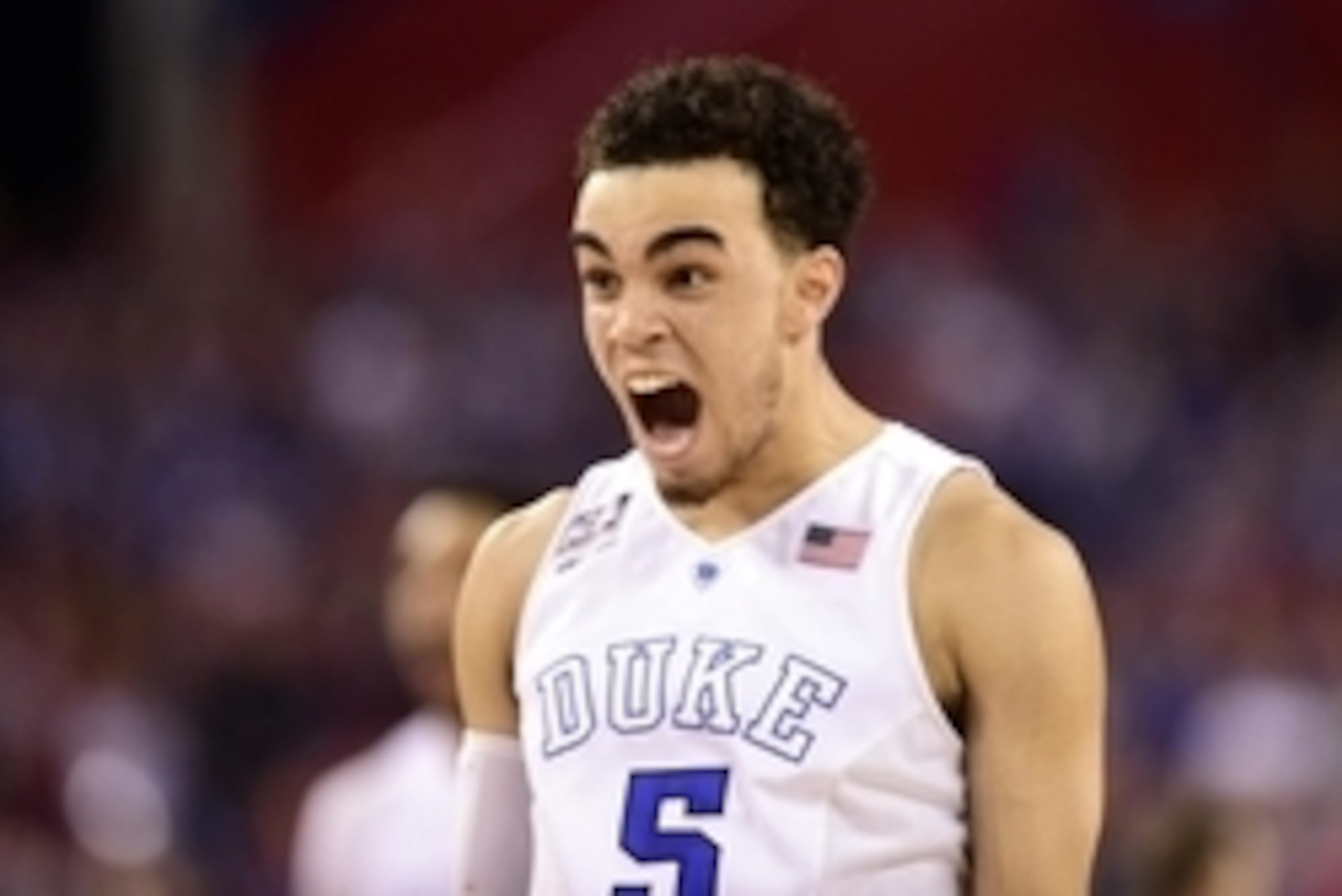 Apr 6, 2015; Indianapolis, IN, USA; Duke Blue Devils guard Tyus Jones (5) reacts after a three-pointer against the Wisconsin Badgers in the second half in the 2015 NCAA Men's Division I Championship game at Lucas Oil Stadium. Mandatory Credit: Bob Donnan-