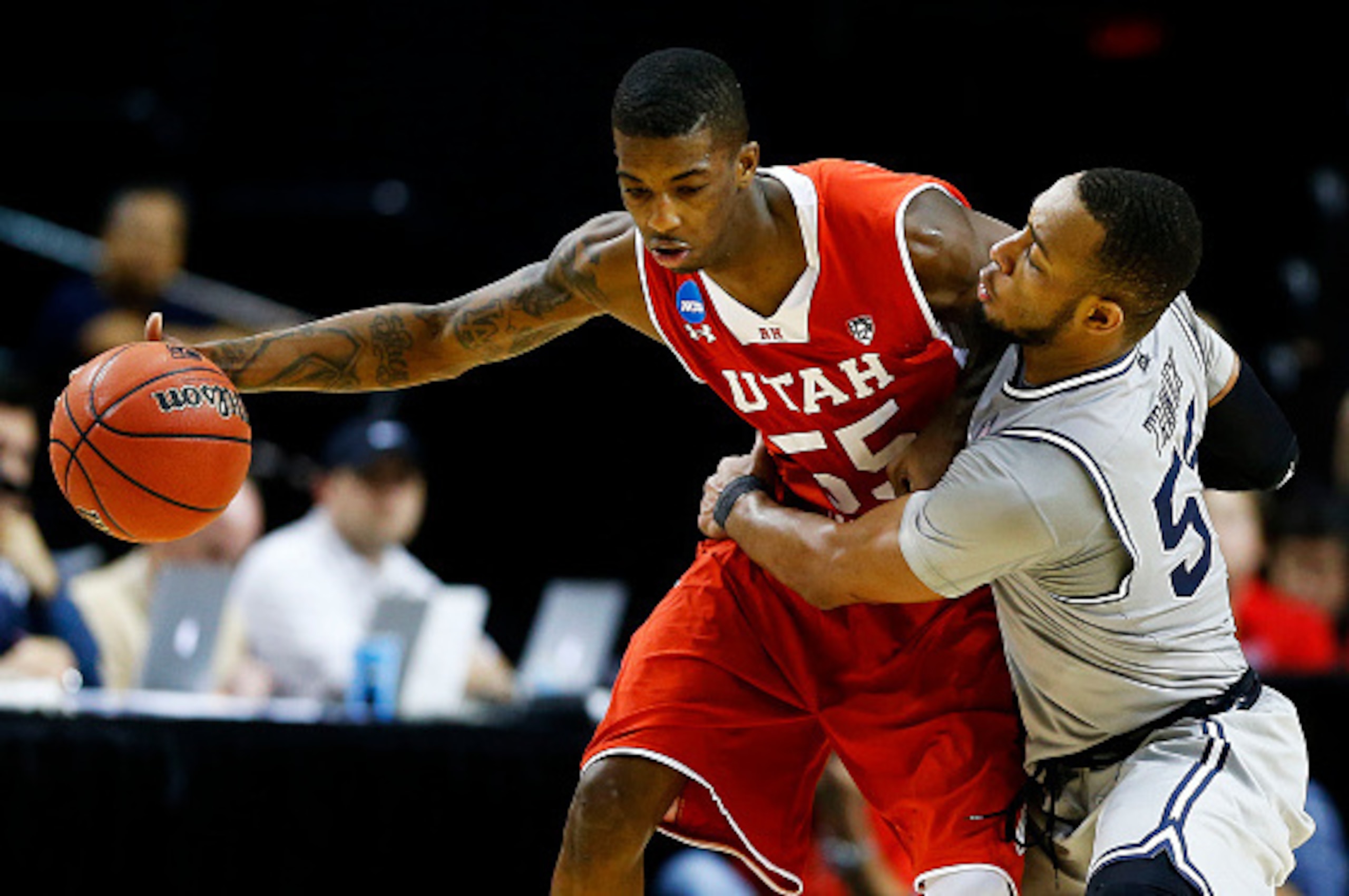 PORTLAND, OR - MARCH 21: Delon Wright #55 of the Utah Utes drives against Jabril Trawick #55 of the Georgetown Hoyas in the second half during the third round of the 2015 NCAA Men's Basketball Tournament at Moda Center on March 21, 2015 in Portland, Oreg PORTLAND, OR - MARCH 21: Delon Wright #55 of the Utah Utes drives against Jabril Trawick #55 of the Georgetown Hoyas in the second half during the third round of the 2015 NCAA Men's Basketball Tournament at Moda Center on March 21, 2015 in Portland, Oreg