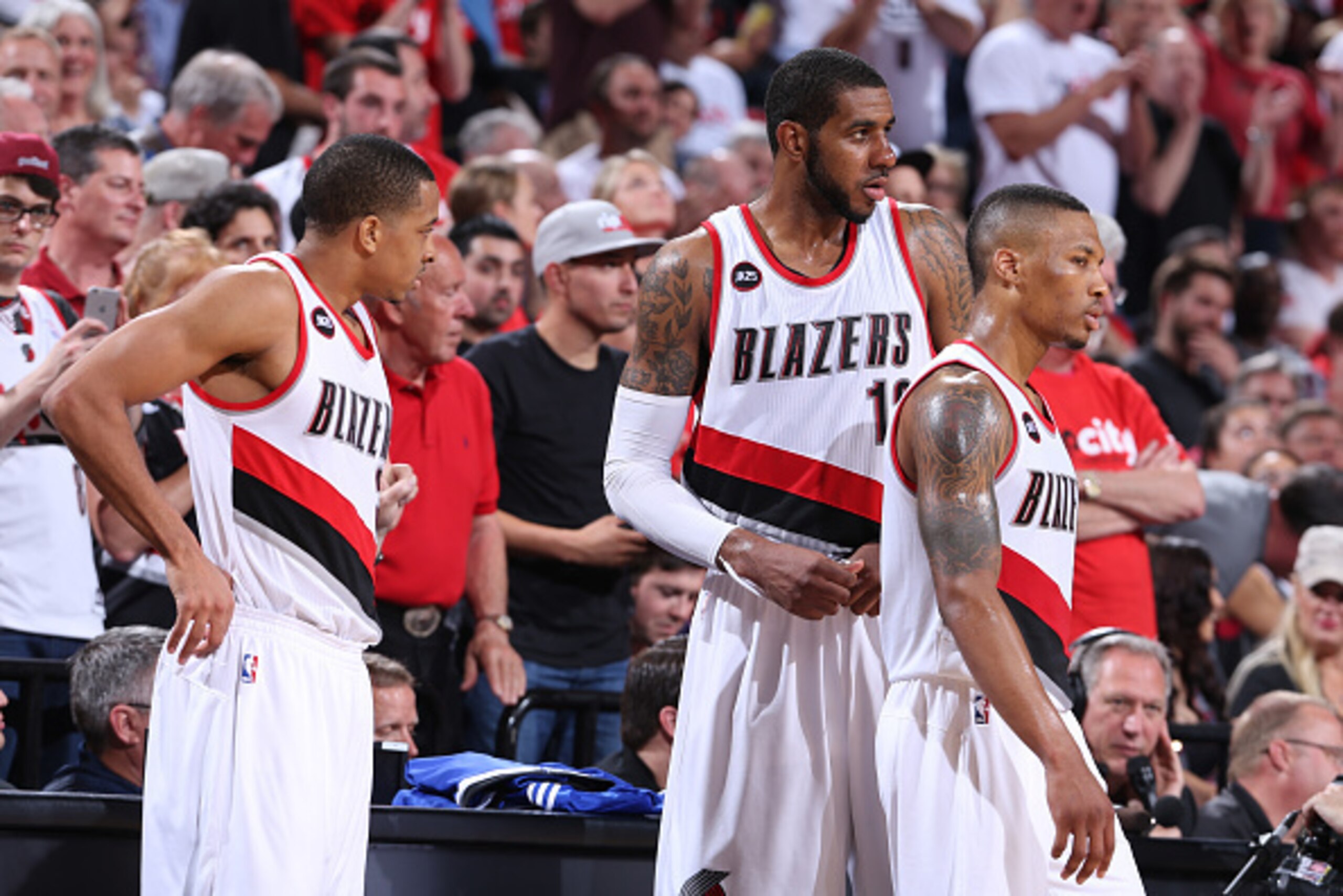PORTLAND, OR - APRIL 27:  C.J. McCollum #3, LaMarcus Aldridge #12 and Damian Lillard #0 of the Portland Trail Blazers walk on the court against the Memphis Grizzlies in Game Four of the Western Conference Quarterfinals during the 2015 NBA Playoffs on Apri