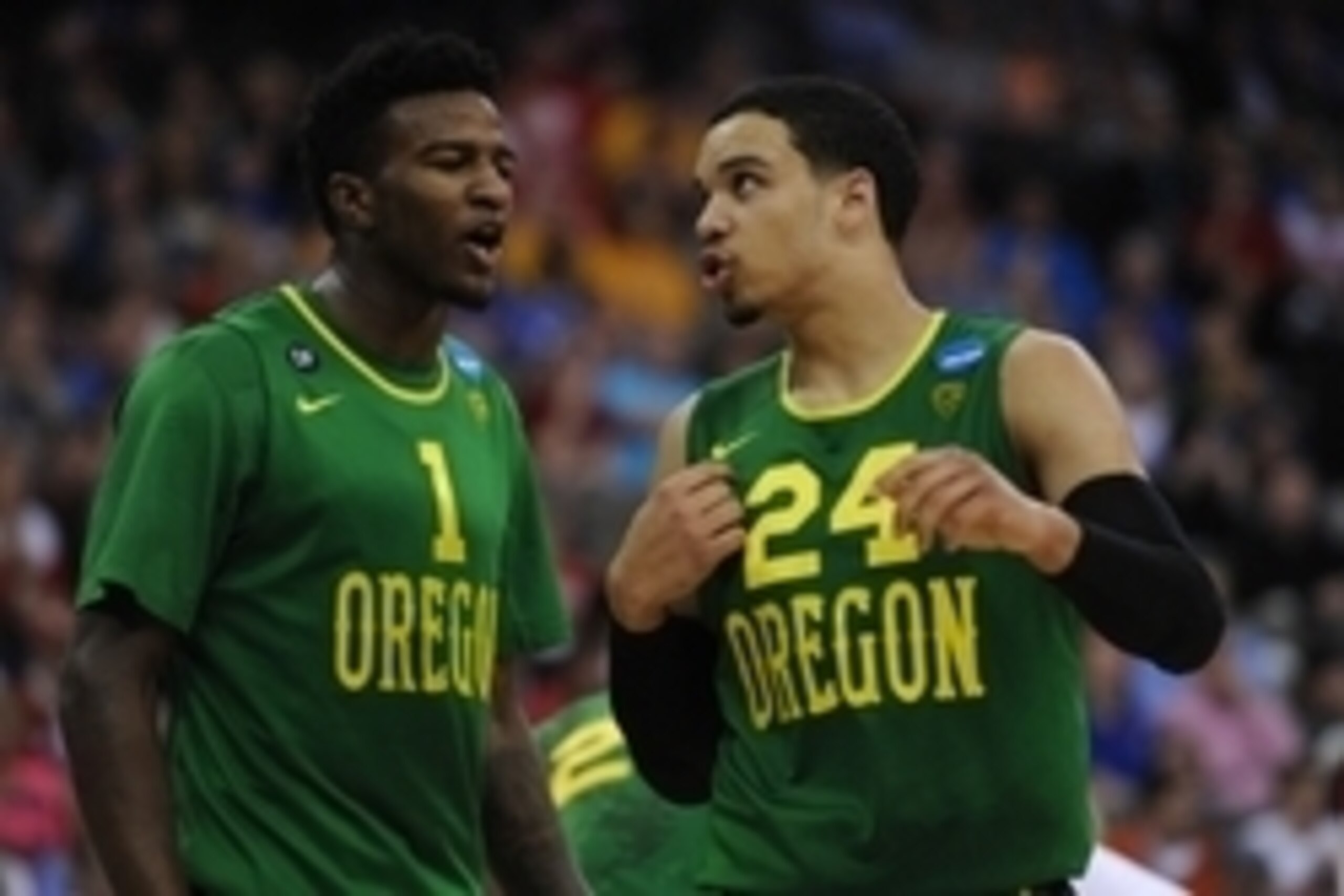 Mar 22, 2015; Omaha, NE, USA; Oregon Ducks forward Jordan Bell (1) and forward Dillon Brooks (24) discuss a call against the Wisconsin Badgers in the third round of the 2015 NCAA Tournament at CenturyLink Center. Wisconsin defeated Oregon 72-65. Mandatory