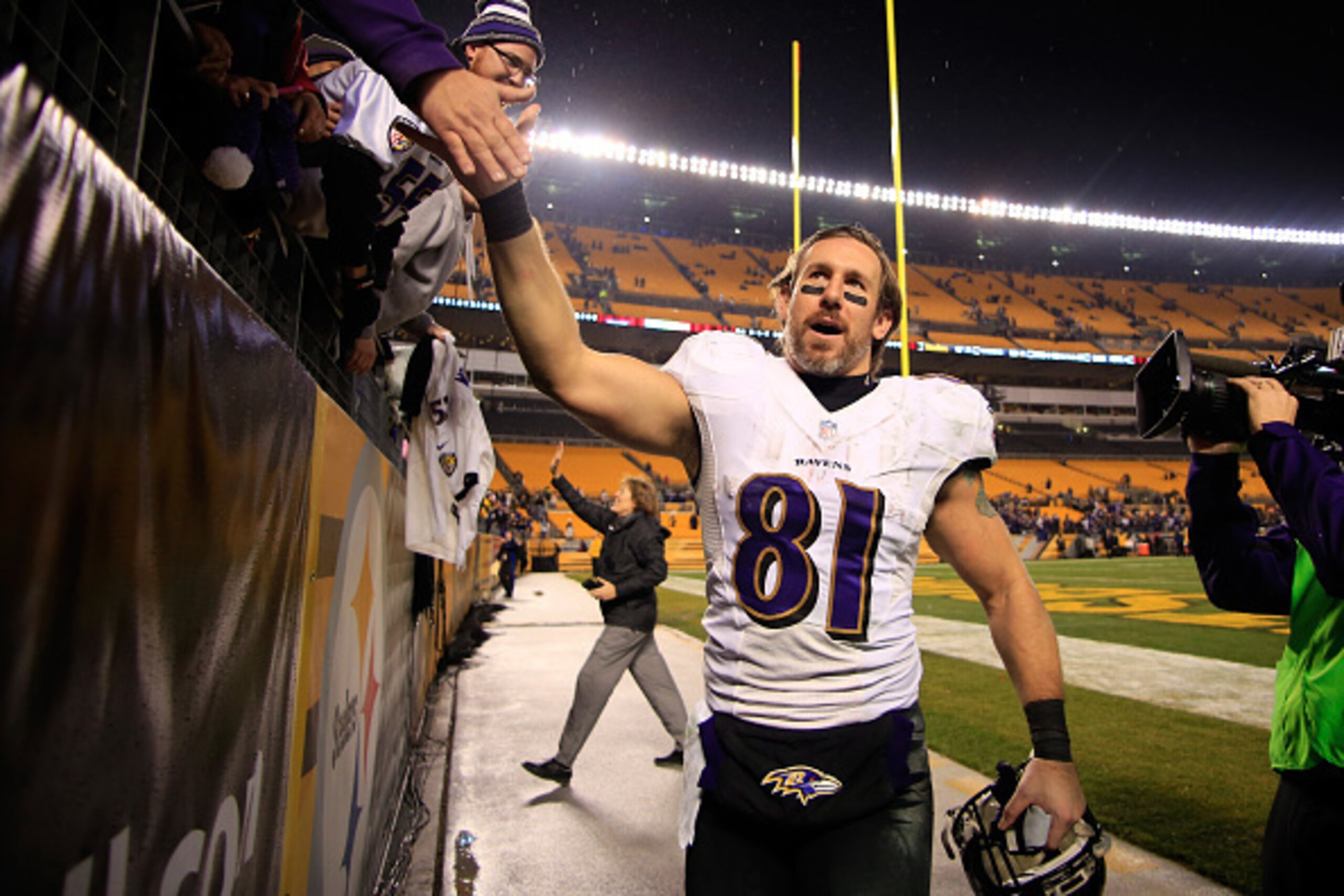 PITTSBURGH, PA - JANUARY 03:  Owen Daniels #81 of the Baltimore Ravens celebrates with fans after defeating the Pittsburgh Steelers 30-17 in their AFC Wild Card game at Heinz Field on January 3, 2015 in Pittsburgh, Pennsylvania.  (Photo by Justin K. Aller
