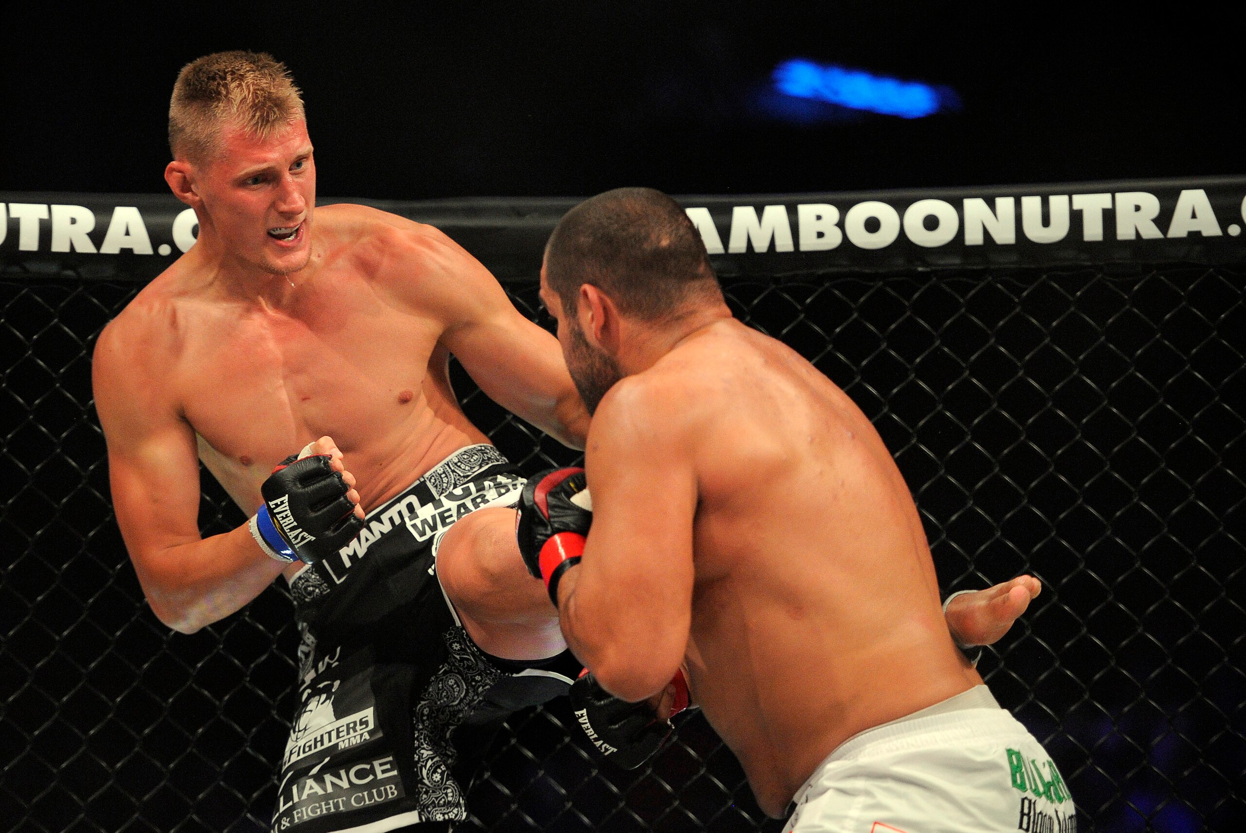 May 17, 2014; Southaven, MS, USA; Blagoi Ivanov (red gloves) fights against Alexander Volkov (blue gloves) during BFC 120 at Landers Center. Mandatory Credit: Justin Ford-USA TODAY Sports