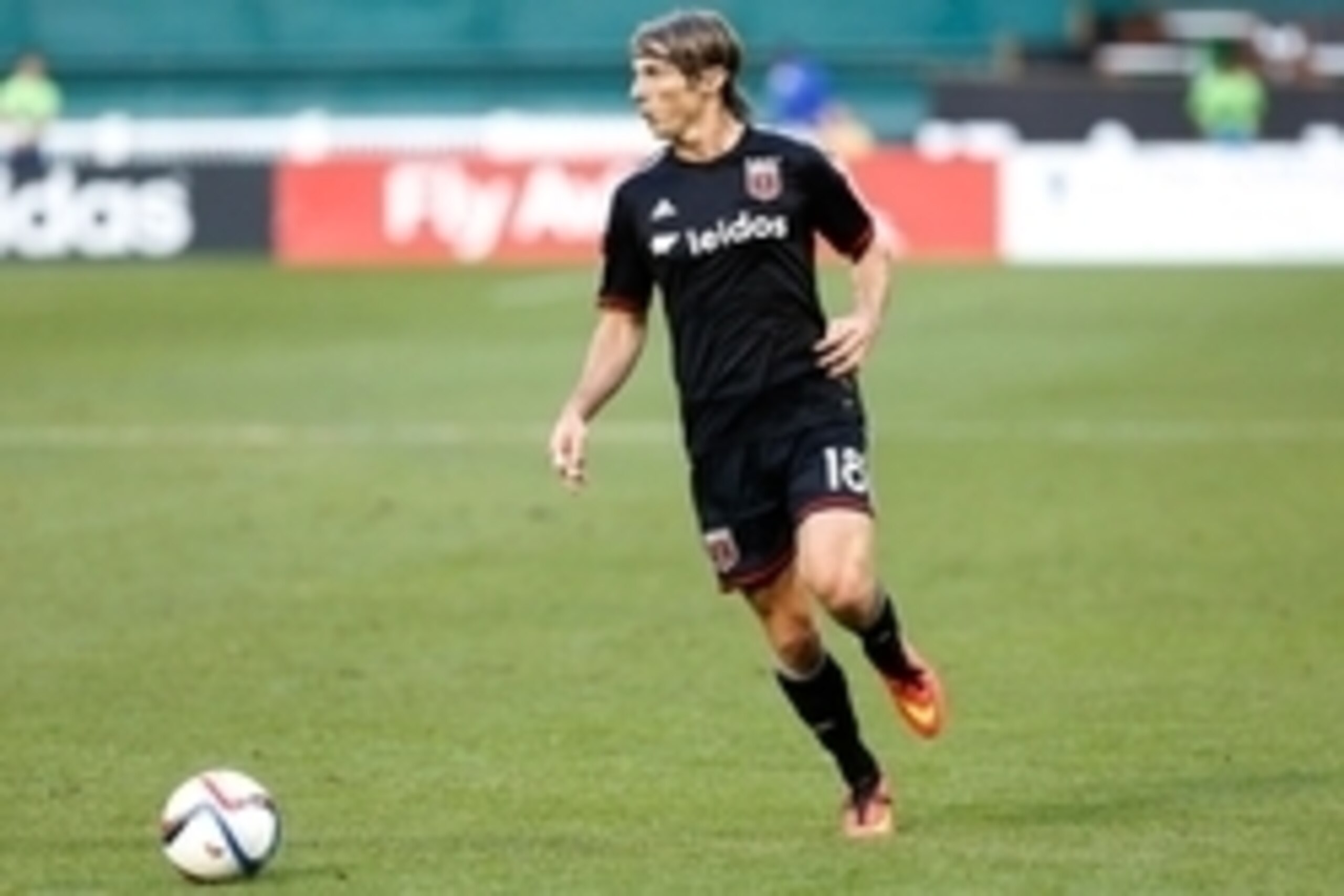 Jun 6, 2015; Washington, DC, USA; D.C. United forward Chris Rolfe (18) dribbles the ball against Toronto FC at Robert F. Kennedy Memorial Stadium. Mandatory Credit: Geoff Burke-USA TODAY Sports
