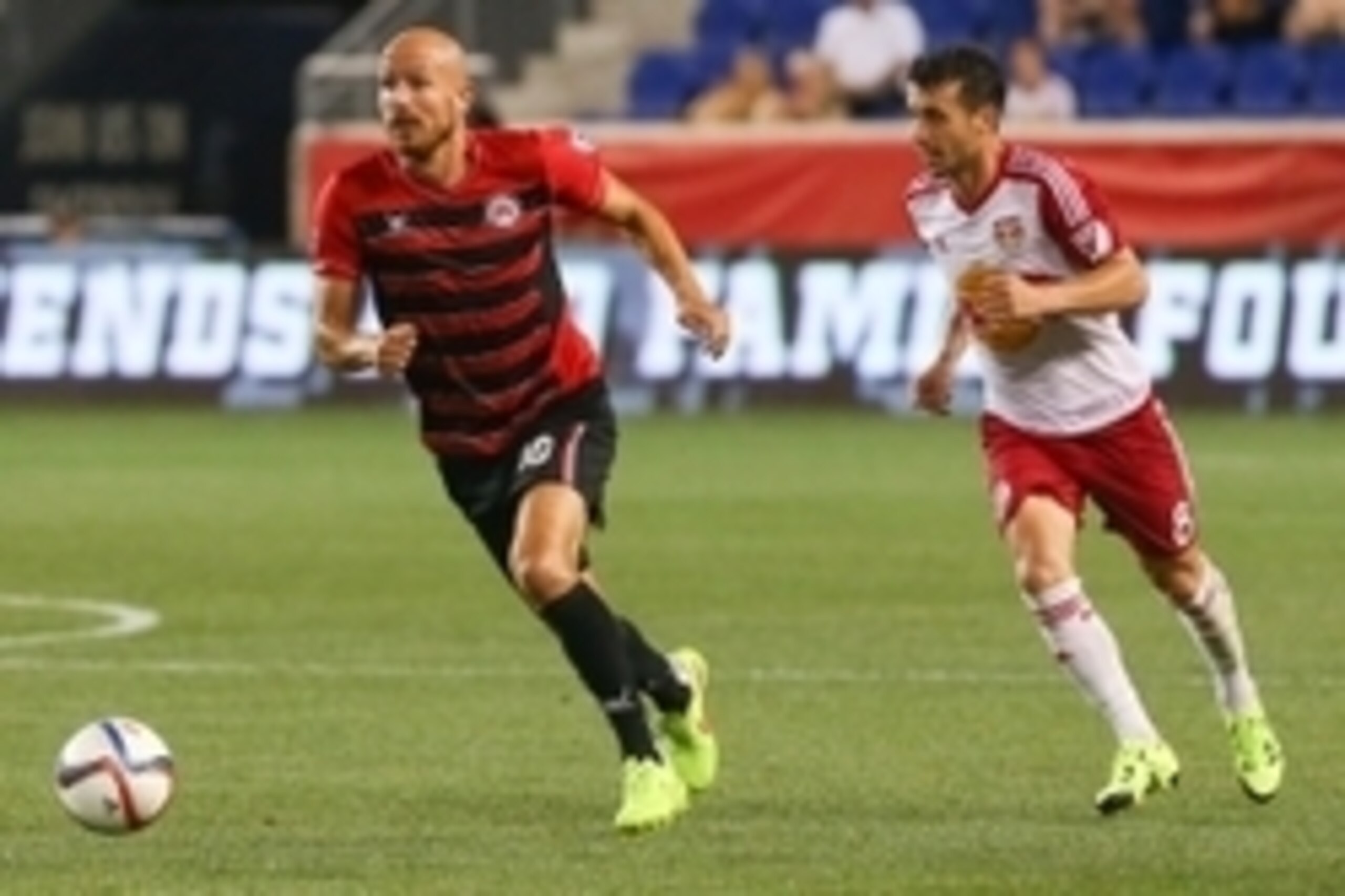 Jun 16, 2015; Harrison, NJ, USA;  Atlanta Silverbacks forward Hans Denissen (10) runs with the ball past New York Red Bulls midfielder Felipe Martins (8) during the second half at Red Bull Arena. The Red Bulls defeated the Silverbacks 3-0.  Mandatory Cred