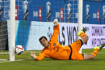 Jun 20, 2015; Montreal, Quebec, CAN; Orlando City FC goalkeeper Tally Hall (22) makes a save against Montreal Impact during the first half at Stade Saputo. Mandatory Credit: Jean-Yves Ahern-USA TODAY Sports