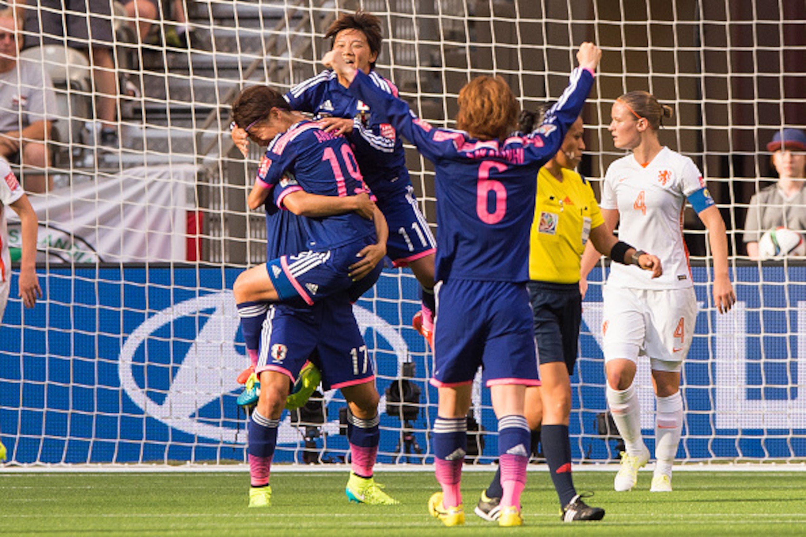 VANCOUVER, BC - JUNE 23: Saori Ariyoshi #19 of Japan celebrates with Yuki Ogimi #17, Shinobu Ohno #11 and Mizuho Sakaguchi #6 after scoring against the Netherlands during the FIFA Women's World Cup Canada 2015 Round of 16 match between the Netherlands and