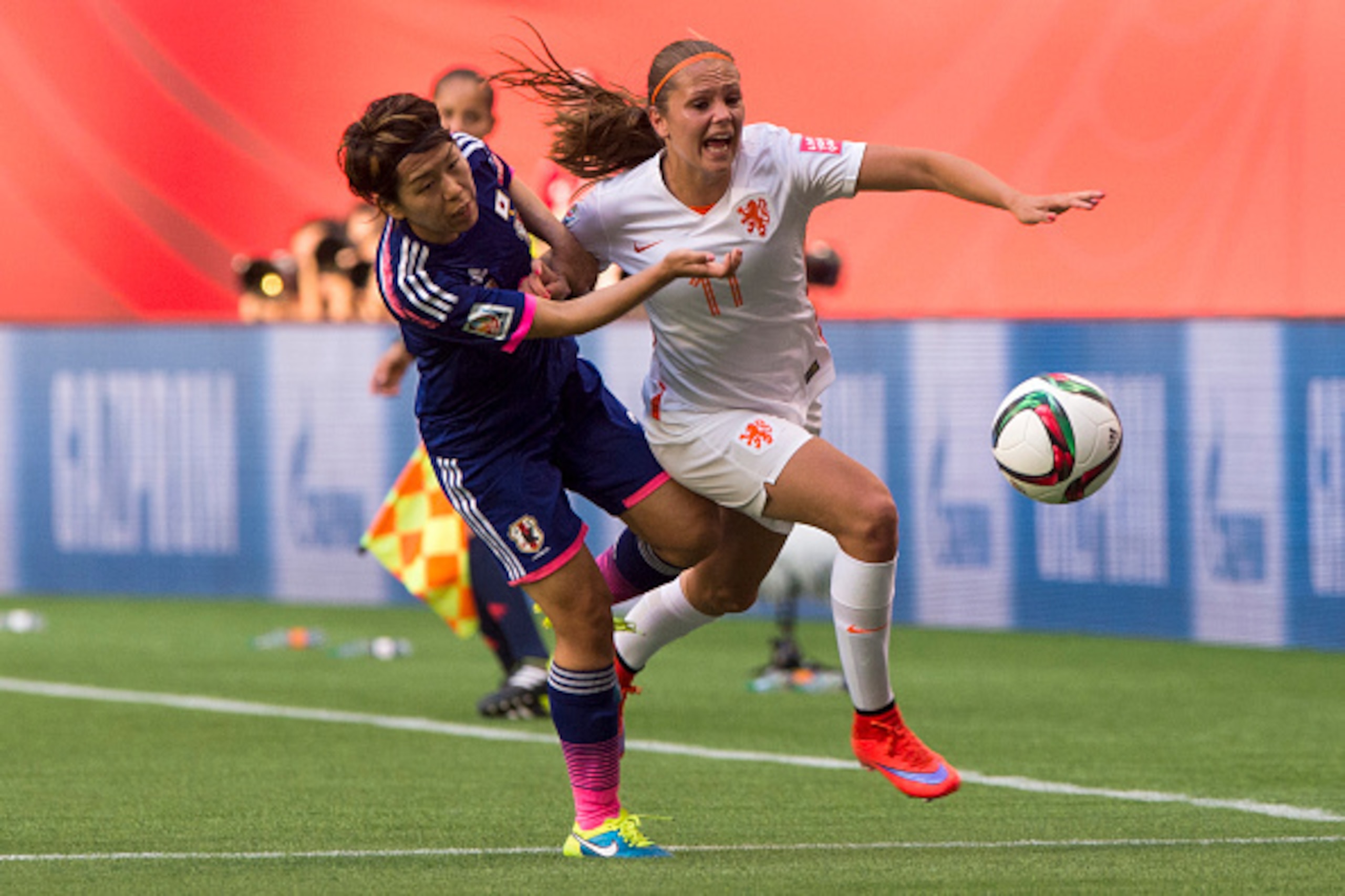 VANCOUVER, BC - JUNE 23: Azusa Iwashimizu #3 of Japan and Lieke Martens #11 of the Netherlands get tangled up while chasing down the loose ball during the FIFA Women's World Cup Canada 2015 Round of 16 match between the Netherlands and Japan June, 23, 201