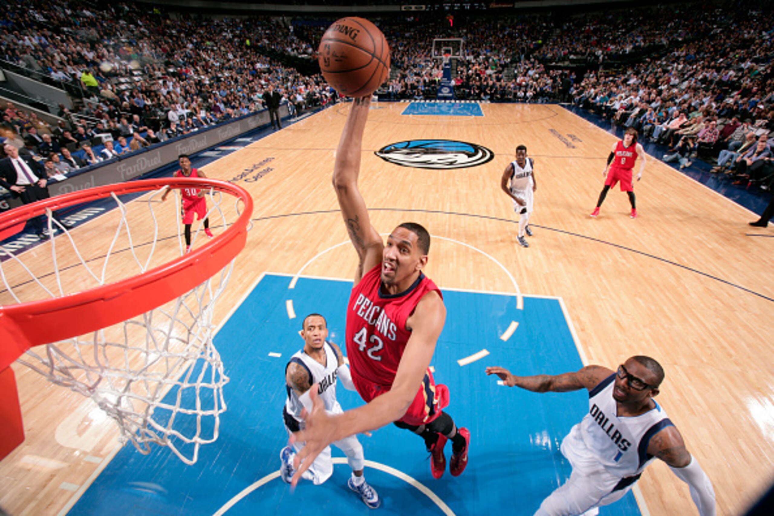 DALLAS, TX - MARCH 2: Alexis Ajinca #42 of the New Orleans Pelicans dunks against the Dallas Mavericks on March 2, 2015 at the American Airlines Center in Dallas, Texas. NOTE TO USER: User expressly acknowledges and agrees that, by downloading and or usin
