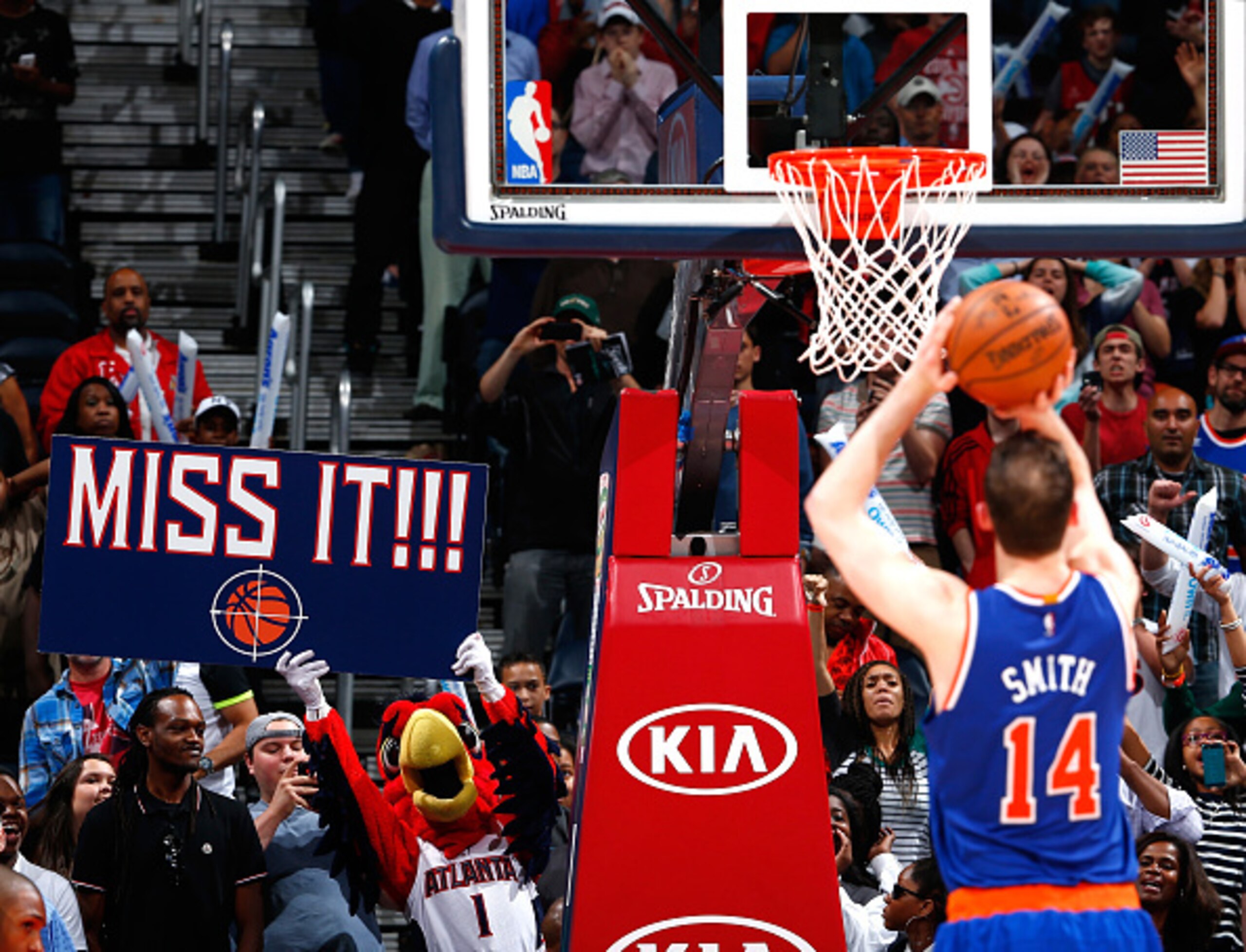 ATLANTA, GA - APRIL 13:  Harry the Hawk, mascot for the Atlanta Hawks, tries to distract Jason Smith #14 of the New York Knicks during a free throw attempt in the second half against the Atlanta Hawks at Philips Arena on April 13, 2015 in Atlanta, Georgia