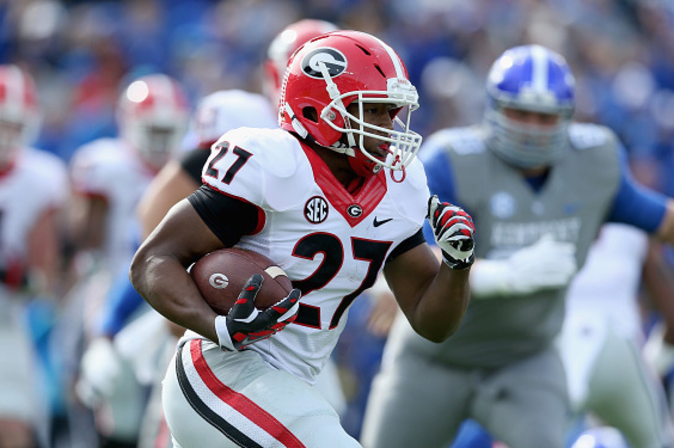 LEXINGTON, KY - NOVEMBER 08:  Nick Chubb #27 of the Georgia Bulldogs runs with the ball during the game against the Kentucky Wildcats at Commonwealth Stadium on November 8, 2014 in Lexington, Kentucky.  (Photo by Andy Lyons/Getty Images)