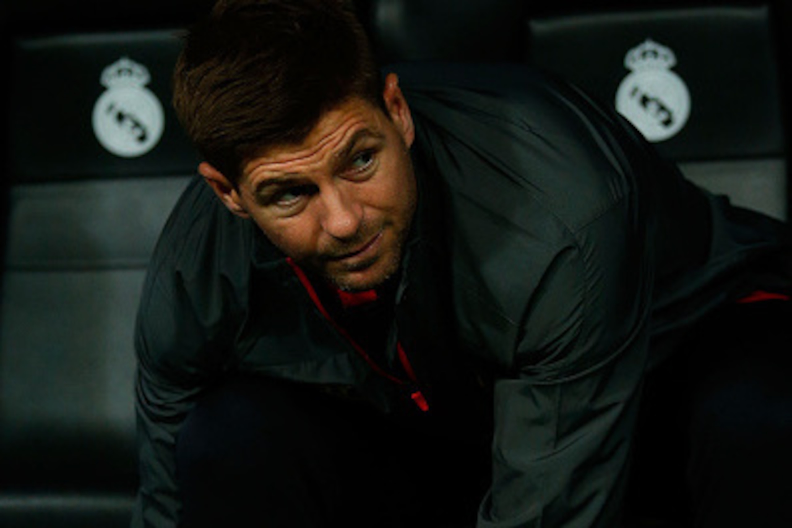 MADRID, SPAIN - NOVEMBER 04:  Steven Gerrard of Liverpool FC fixes his boots sitted on the bench prior to start the UEFA Champions League Group B match between Real Madrid CF and Liverpool FC at Estadio Santiago Bernabeu on November 4, 2014 in Madrid, Spa