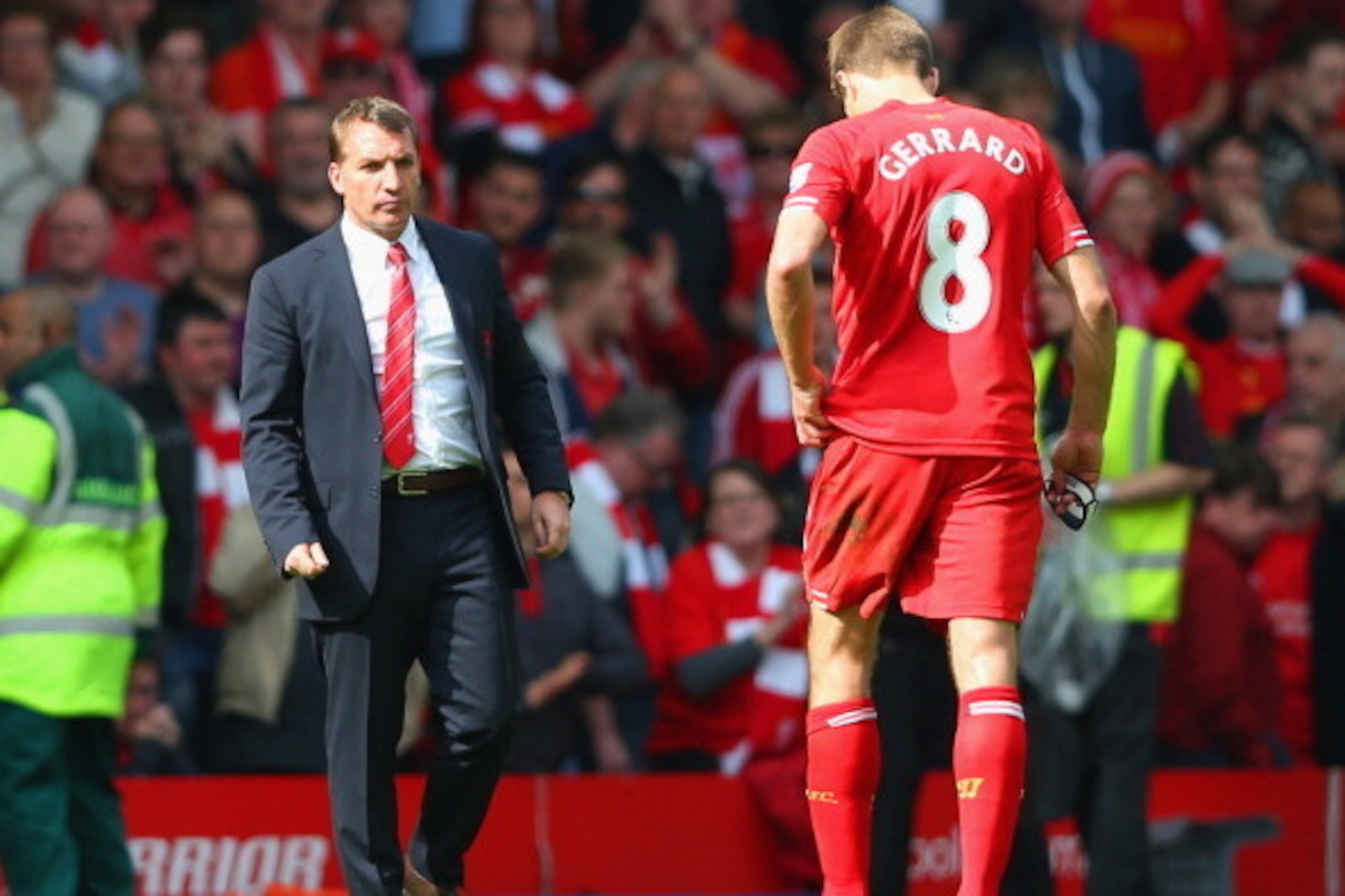 LIVERPOOL, ENGLAND - APRIL 27:  Manager Brendan Rodgers of Liverpool looks to a dejected Steven Gerrard of Liverpool at the end of the match during the Barclays Premier League match between Liverpool and Chelsea at Anfield on April 27, 2014 in Liverpool, 