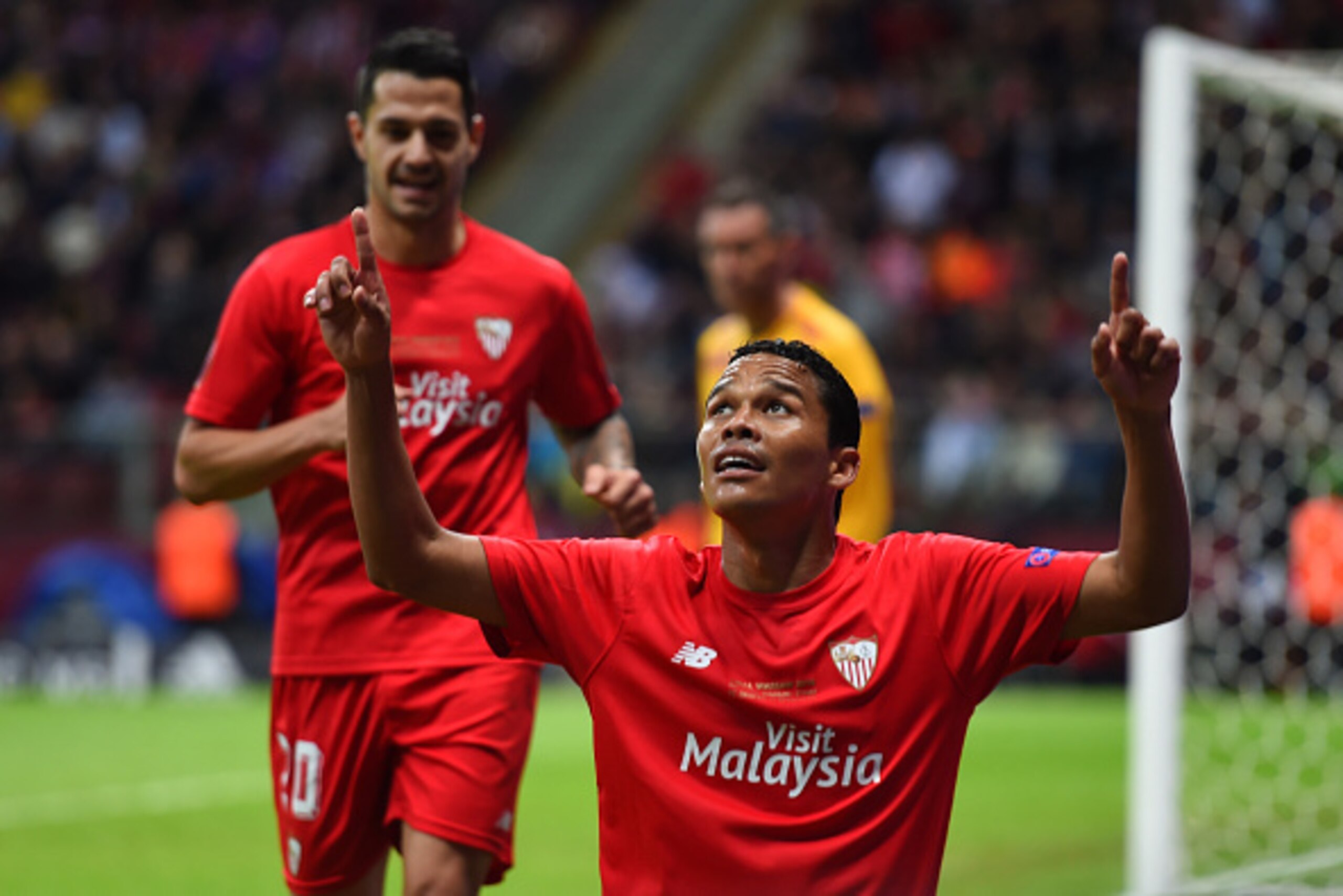 WARSAW, POLAND - MAY 27:  Carlos Bacca of Sevilla celebrates scoring his team's second goal during the UEFA Europa League Final match between FC Dnipro Dnipropetrovsk and FC Sevilla on May 27, 2015 in Warsaw, Poland.  (Photo by Shaun Botterill/Getty Image