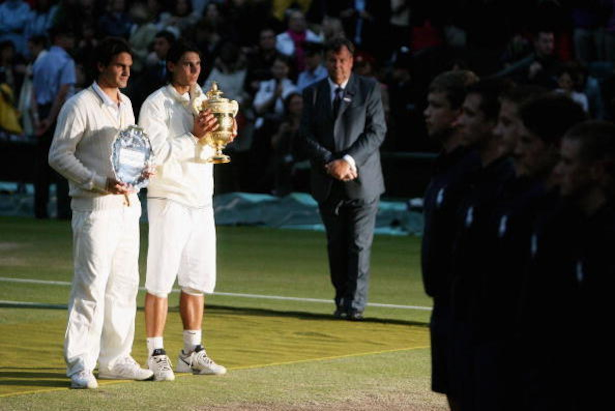 LONDON - JULY 06:  Rafael Nadal of Spain poses with the trophy and Roger Federer of Switzerland poses with the runners up trophy after the men's singles Final match on day thirteen of the Wimbledon Lawn Tennis Championships at the All England Lawn Tennis 