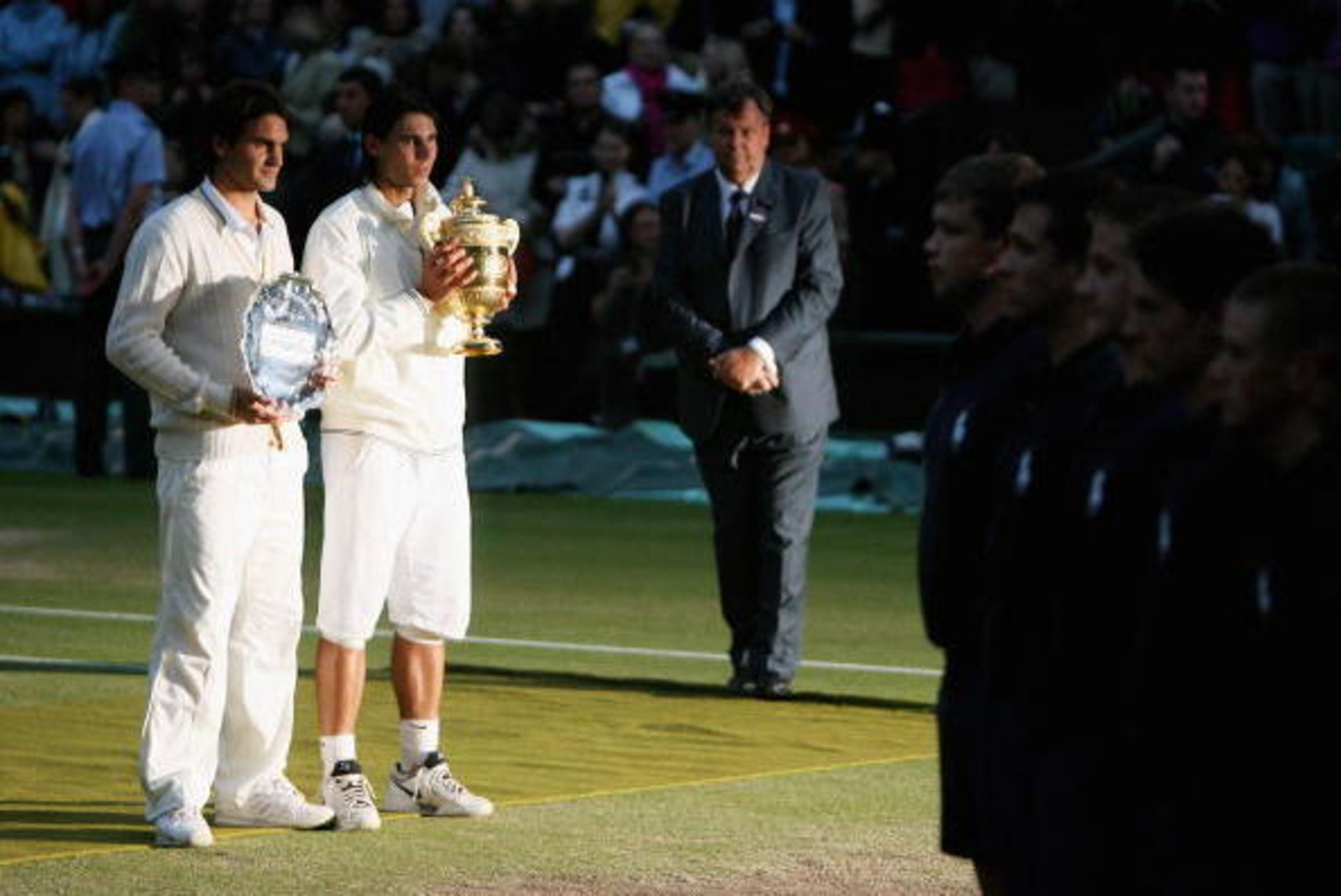 LONDON - JULY 06:  Rafael Nadal of Spain poses with the trophy and Roger Federer of Switzerland poses with the runners up trophy after the men's singles Final match on day thirteen of the Wimbledon Lawn Tennis Championships at the All England Lawn Tennis 