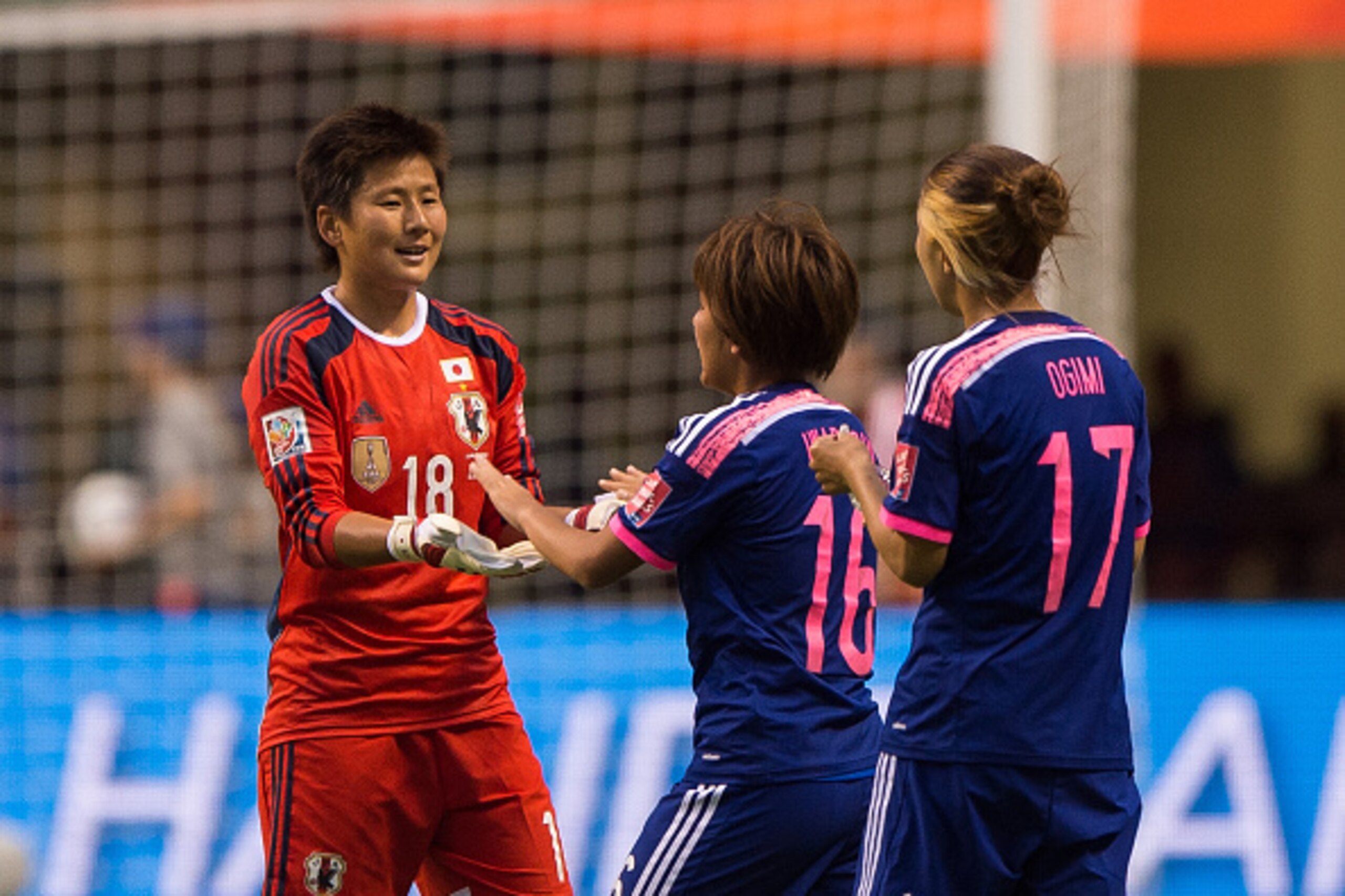 VANCOUVER, BC - JUNE 23: Goalkeeper Ayumi Kaihori #18 of Japana celebrates with Mana Iwabuchi #16 and Yuki Ogimi #17 after defeating the Netherlands 2-1 during the FIFA Women's World Cup Canada 2015 Round of 16 match between the Netherlands and Japan June