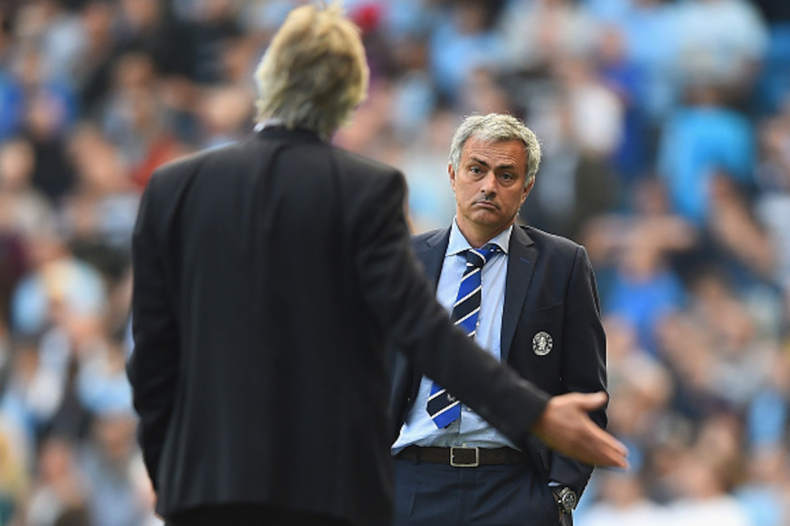 MANCHESTER, ENGLAND - SEPTEMBER 21: Jose Mourinho of Chelsea speaks with Manuel Pellegrini of Manchester City during the Barclays Premier League match between Manchester City and Chelsea at Etihad Stadium on September 21, 2014 in Manchester, England.  (Ph