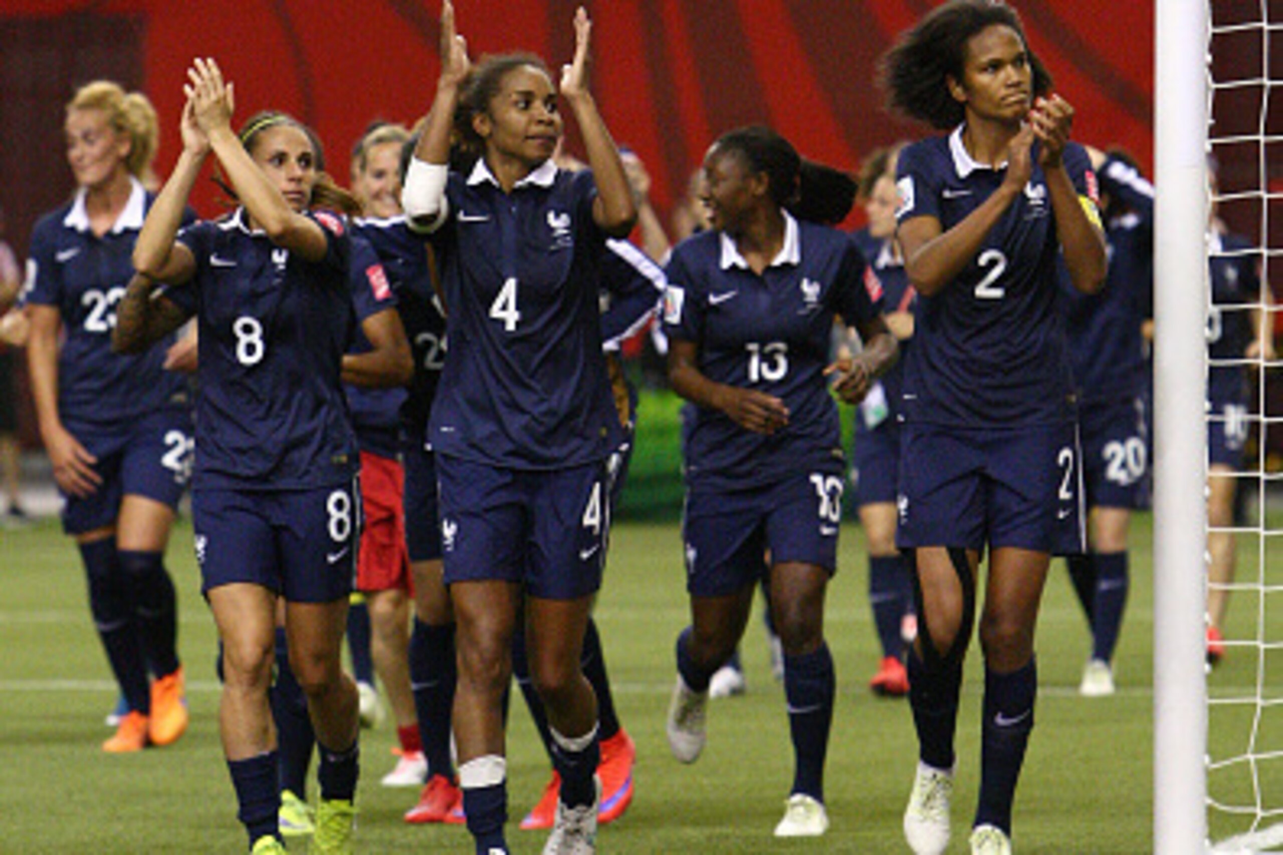 MONTREAL, QC - JUNE 21: Team France runs around the field and saluts the crowd after their 3-0 victory over Korea during the FIFA Women's World Cup Canada 2015 round of 16 match between France and Korea Republic at Olympic Stadium on June 21, 2015 in Mont