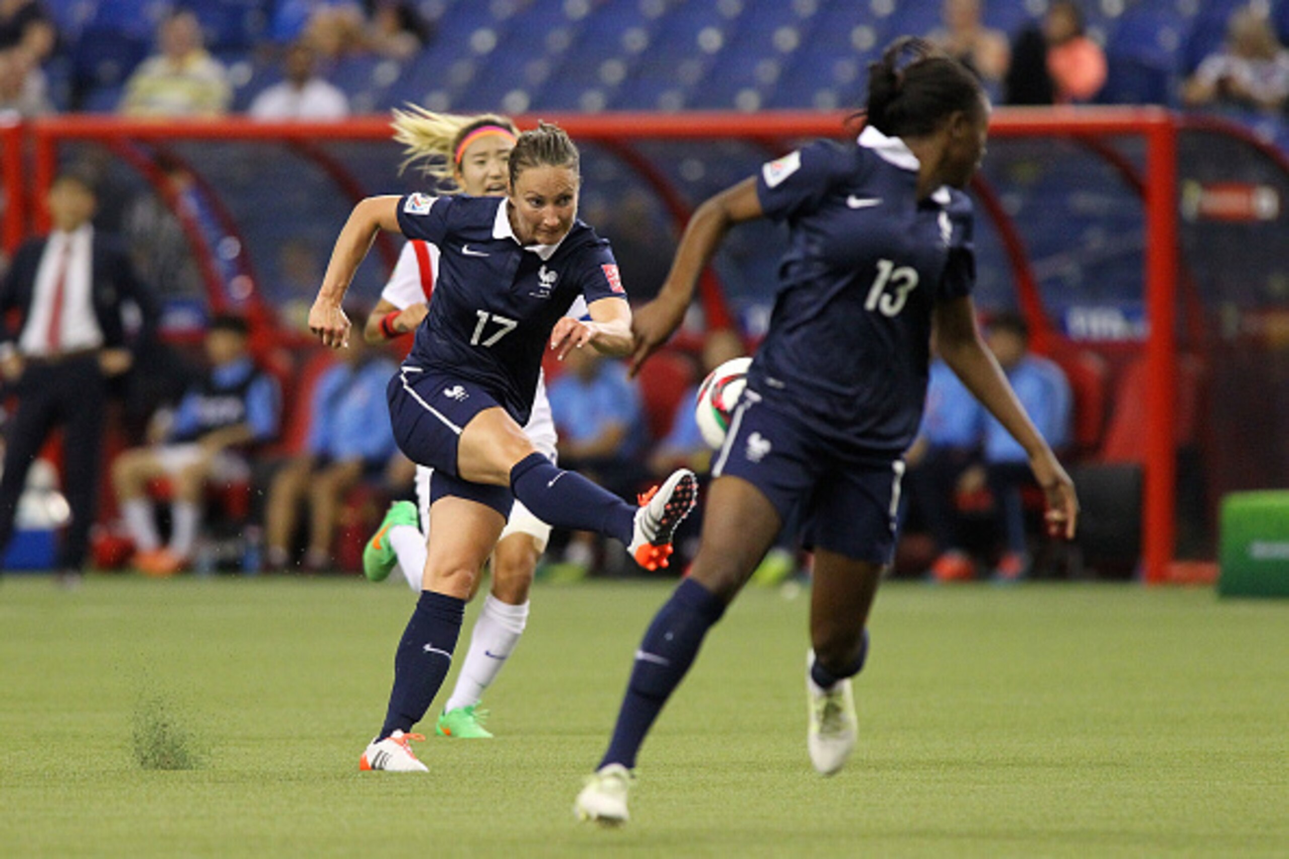 MONTREAL, QC - JUNE 21: Gaetane Thiney #17 of France kicks the ball against team Korea during the FIFA Women's World Cup Canada 2015 round of 16 match between France and Korea Republic at Olympic Stadium on June 21, 2015 in Montreal, Canada.  (Photo by Fr