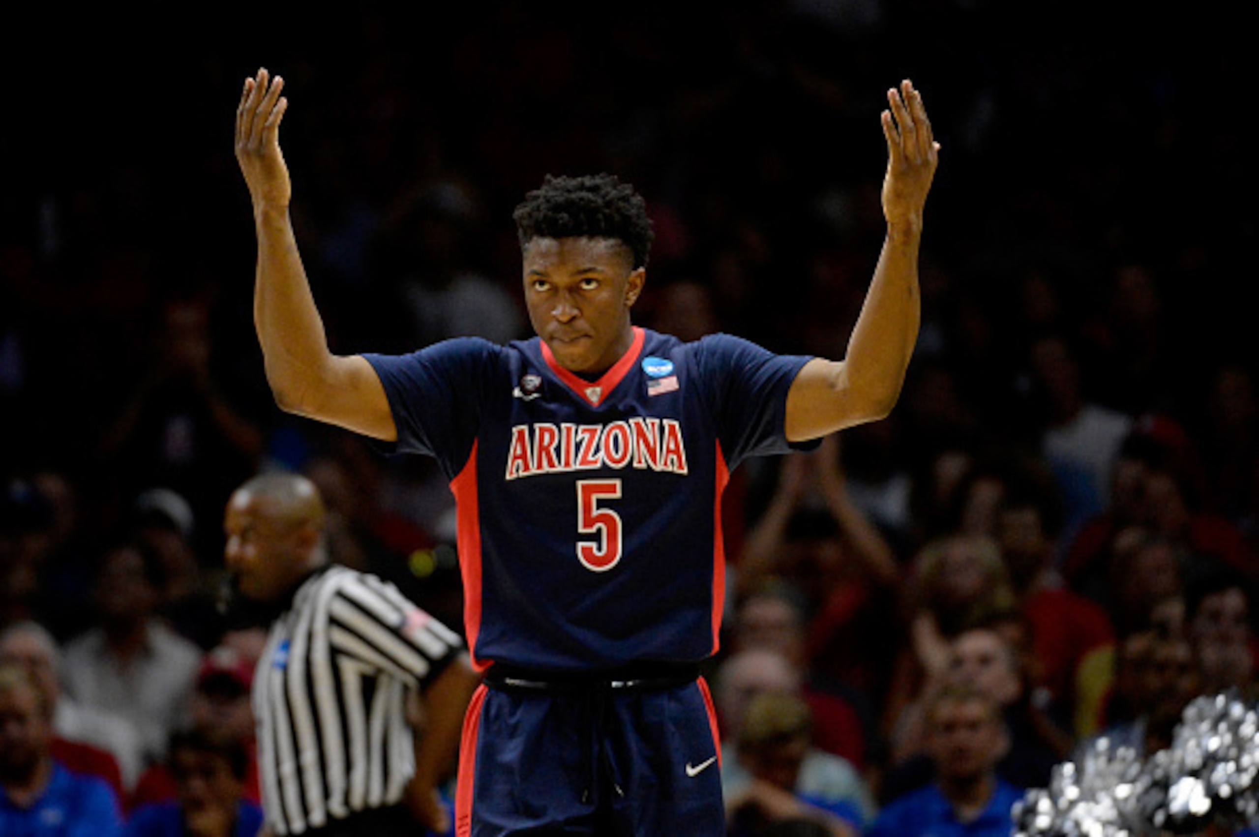 LOS ANGELES, CA - MARCH 28:  Stanley Johnson #5 of the Arizona Wildcats reacts in the first half while taking on the Wisconsin Badgers during the West Regional Final of the 2015 NCAA Men's Basketball Tournament at Staples Center on March 28, 2015 in Los A