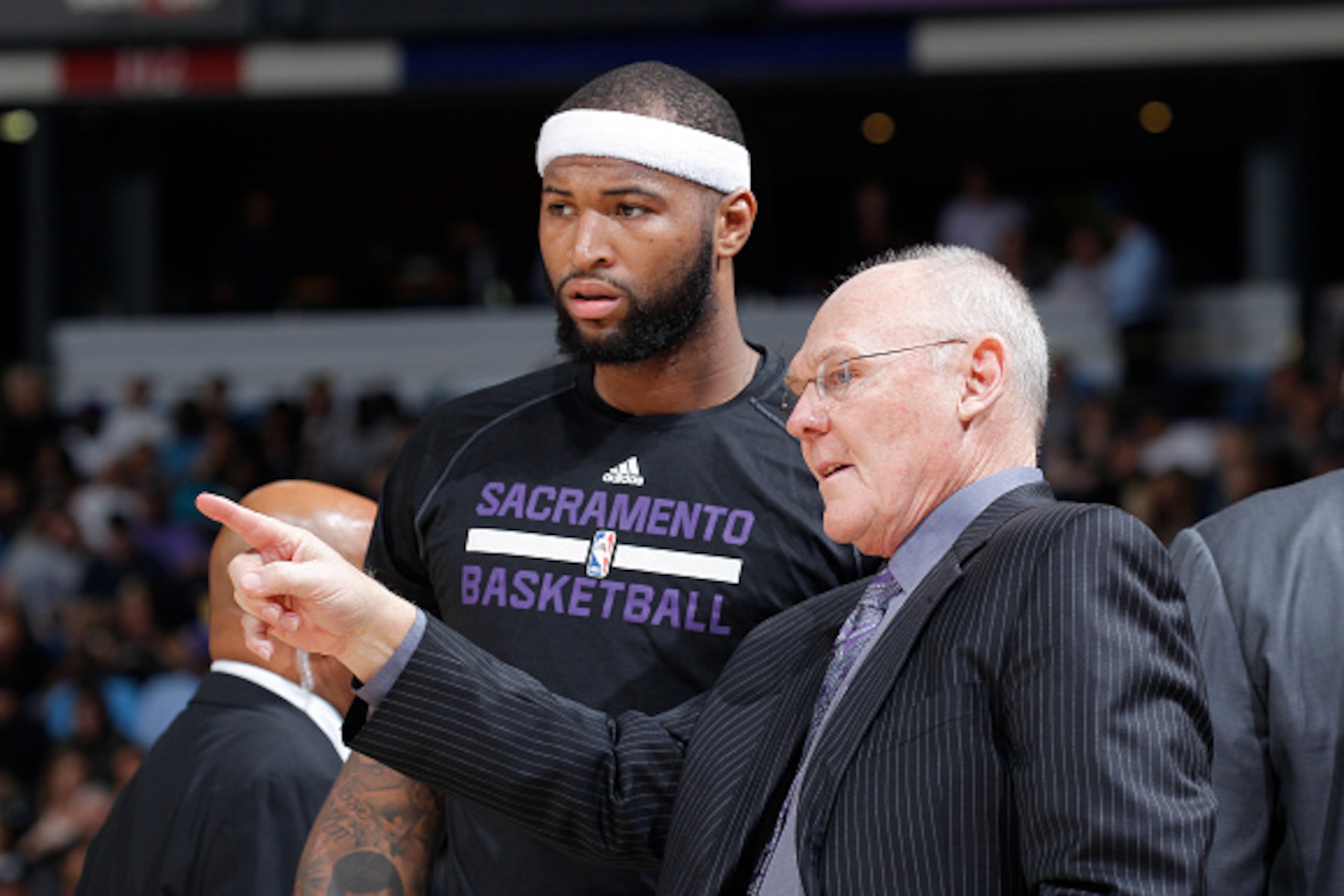 SACRAMENTO, CA - MARCH 16: Head coach George Karl of the Sacramento Kings coaches DeMarcus Cousins #15 against the Atlanta Hawks on March 16, 2015 at Sleep Train Arena in Sacramento, California. NOTE TO USER: User expressly acknowledges and agrees that, b