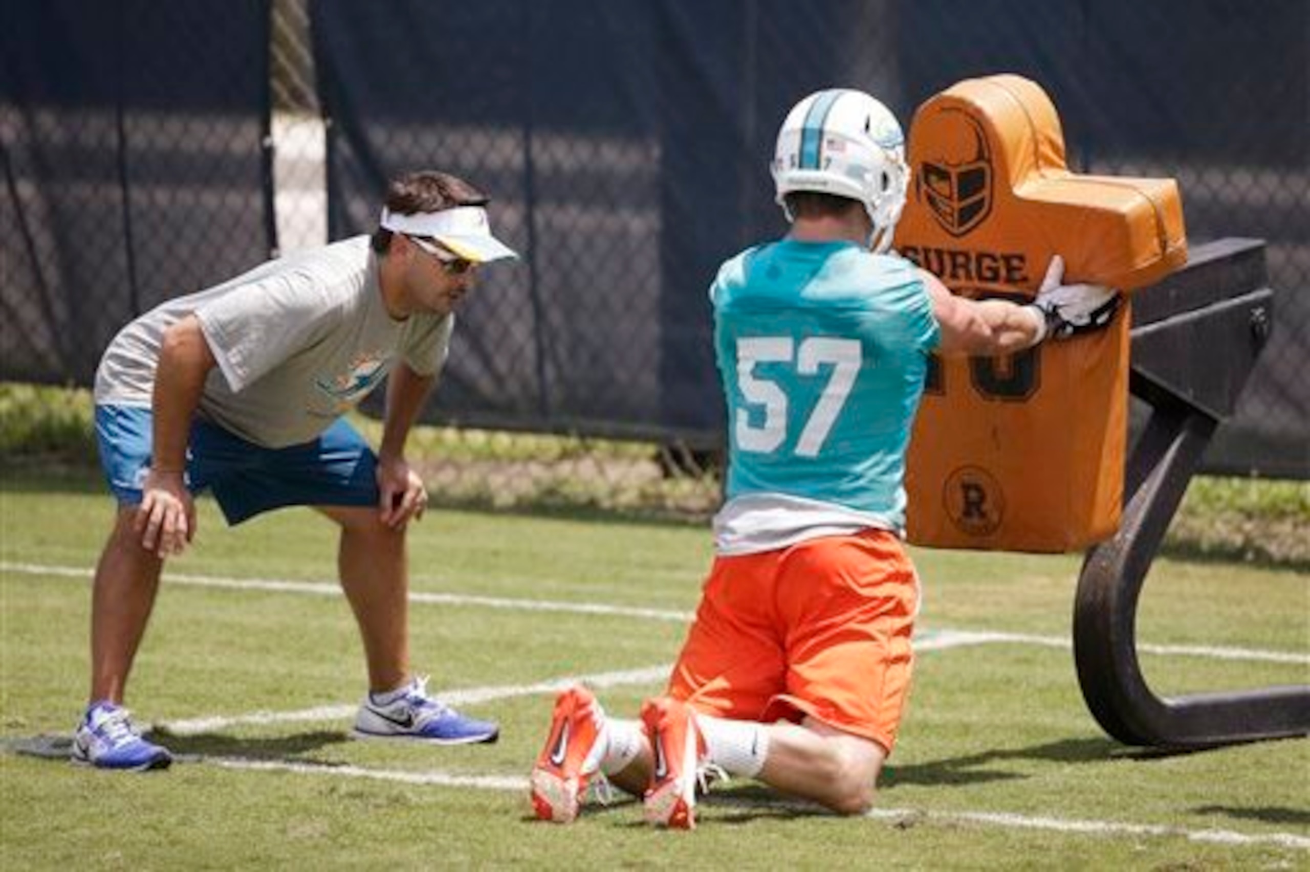 Jordan Tripp (57, right) spent most of his rookie season on the special teams units.