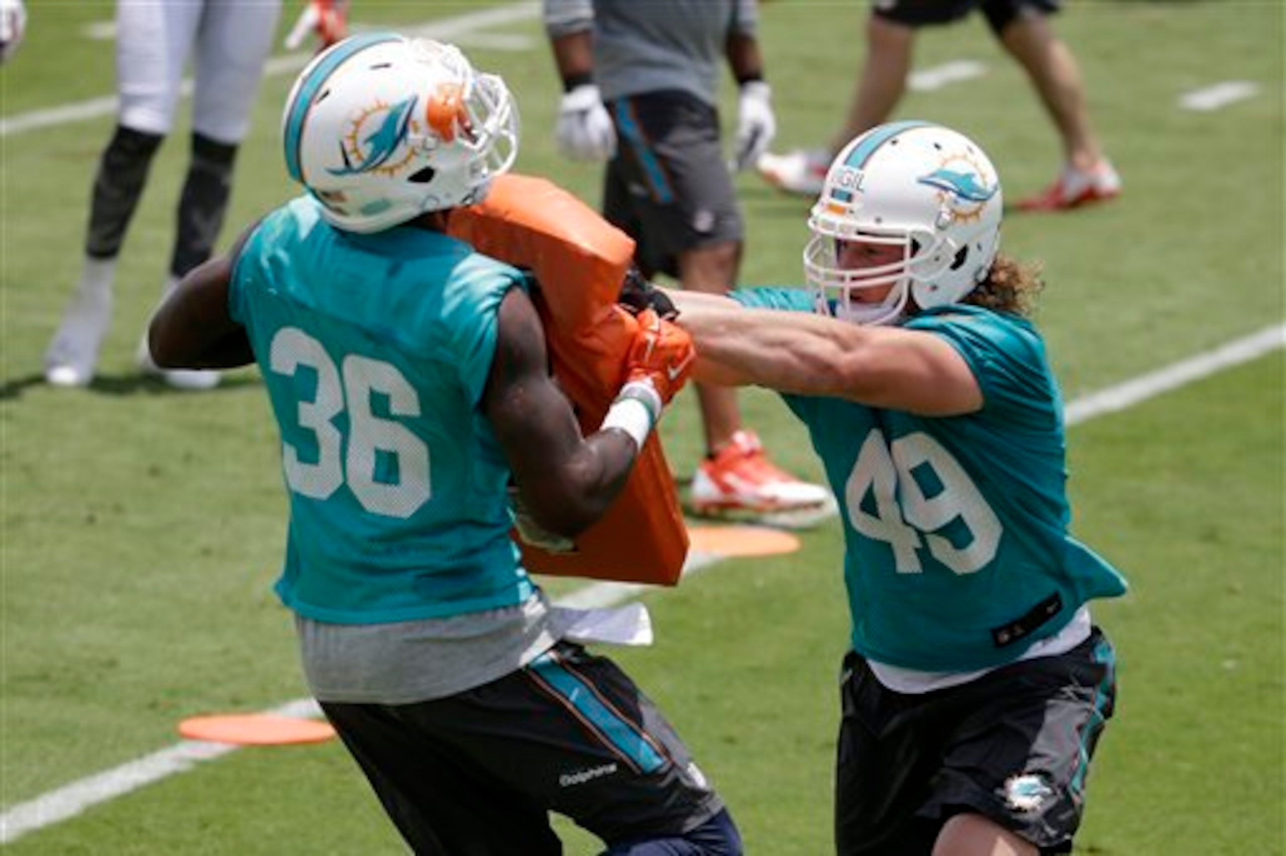 Zach Vigil (49, right) is fighting for a roster spot.