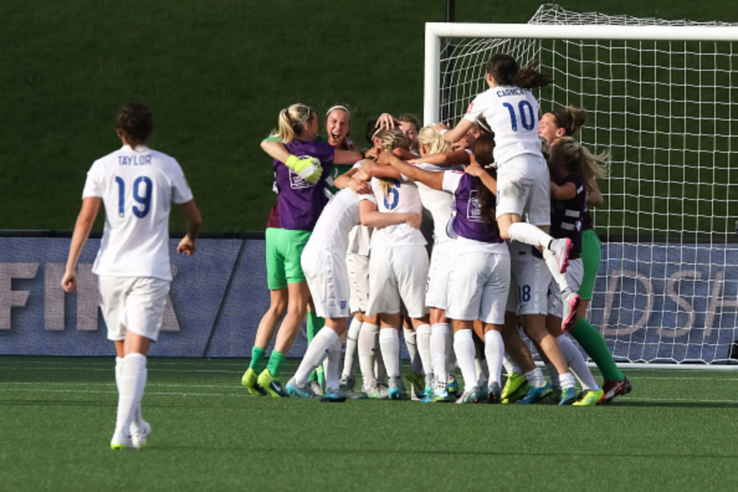 OTTAWA, ON - JUNE 22: Karen Bardsley #1 and Karen Carney #10 of England celebrate their team's win with team mates after the FIFA Women's World Cup Canada 2015 round of 16 match between Norway and England at Lansdowne Stadium on June 22, 2015 in Ottawa, C