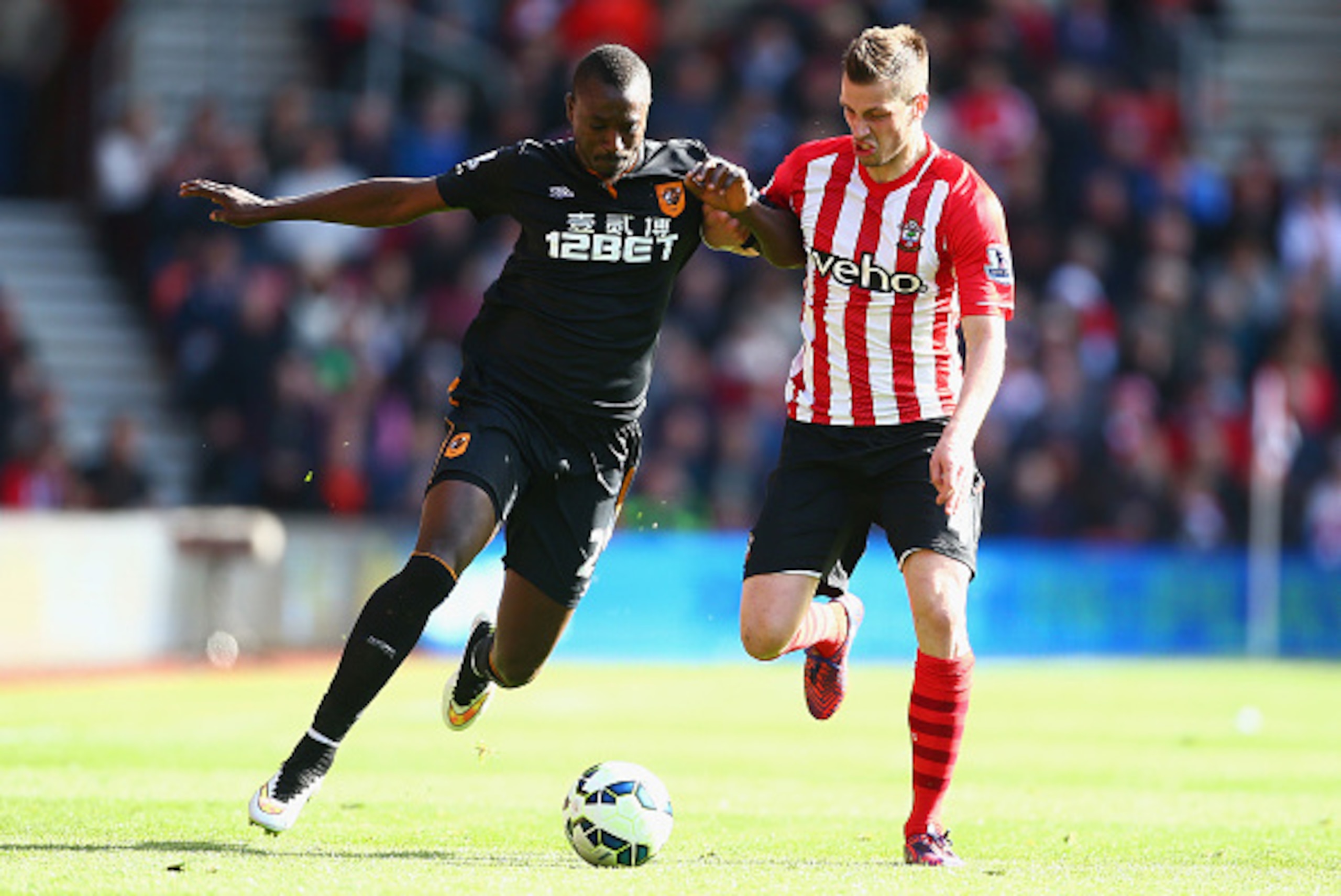 SOUTHAMPTON, ENGLAND - APRIL 11:  Liam Rosenior of Hull City holds off Morgan Schneiderlin of Southampton  during the Barclays Premier League match between Southampton and Hull City at St Mary's Stadium on April 11, 2015 in Southampton, England.  (Photo b
