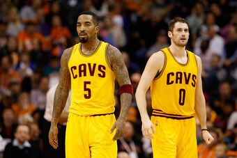PHOENIX, AZ - JANUARY 13:  J.R. Smith #5 and Kevin Love #0 of the Cleveland Cavaliers during the NBA game against the Phoenix Suns at US Airways Center on January 13, 2015 in Phoenix, Arizona.  NOTE TO USER: User expressly acknowledges and agrees that, by