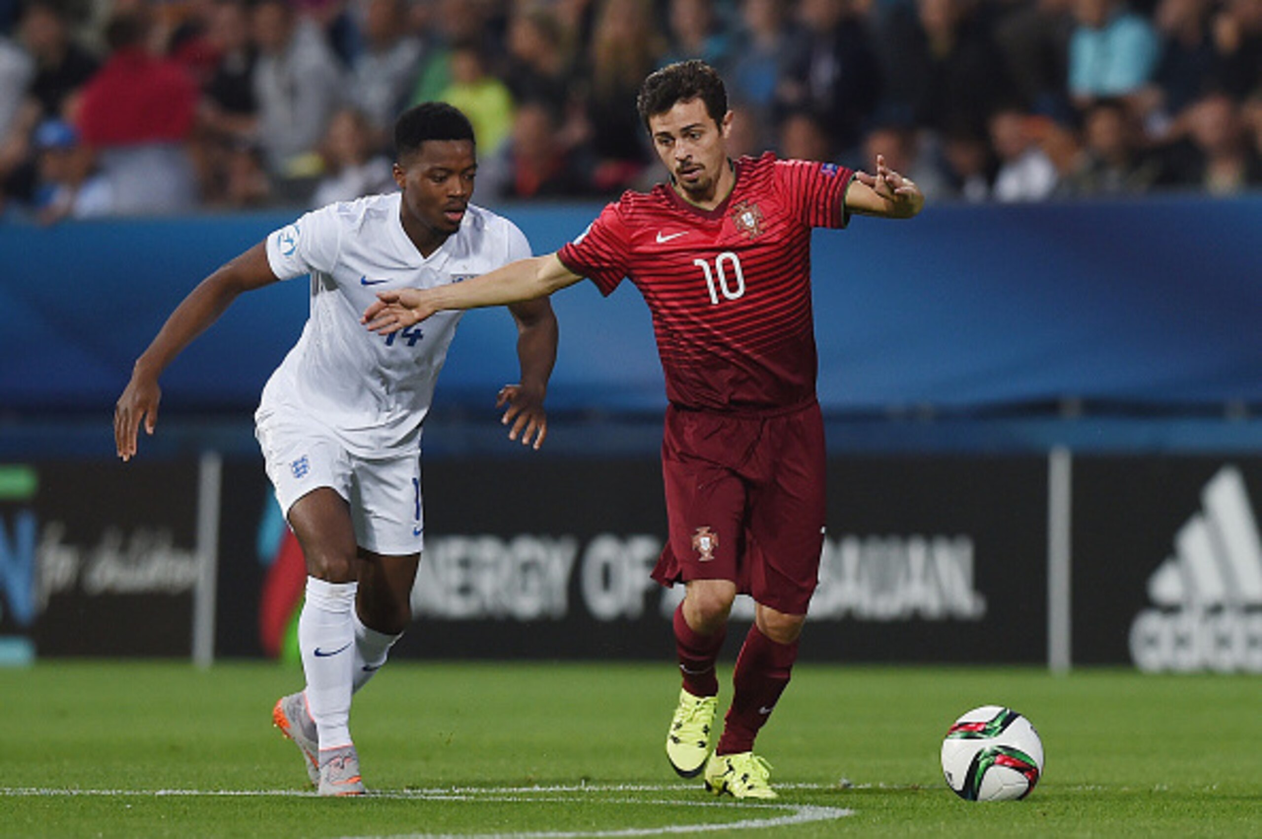 UHERSKE HRADISTE, CZECH REPUBLIC - JUNE 18: Nathaniel Chalobah of England in action with Bernardo Silva of Portugal during the UEFA Under21 European Championship 2015 Group B match between England and Portugal at Mestsky Fotbalovy Stadium on June 18, 2015