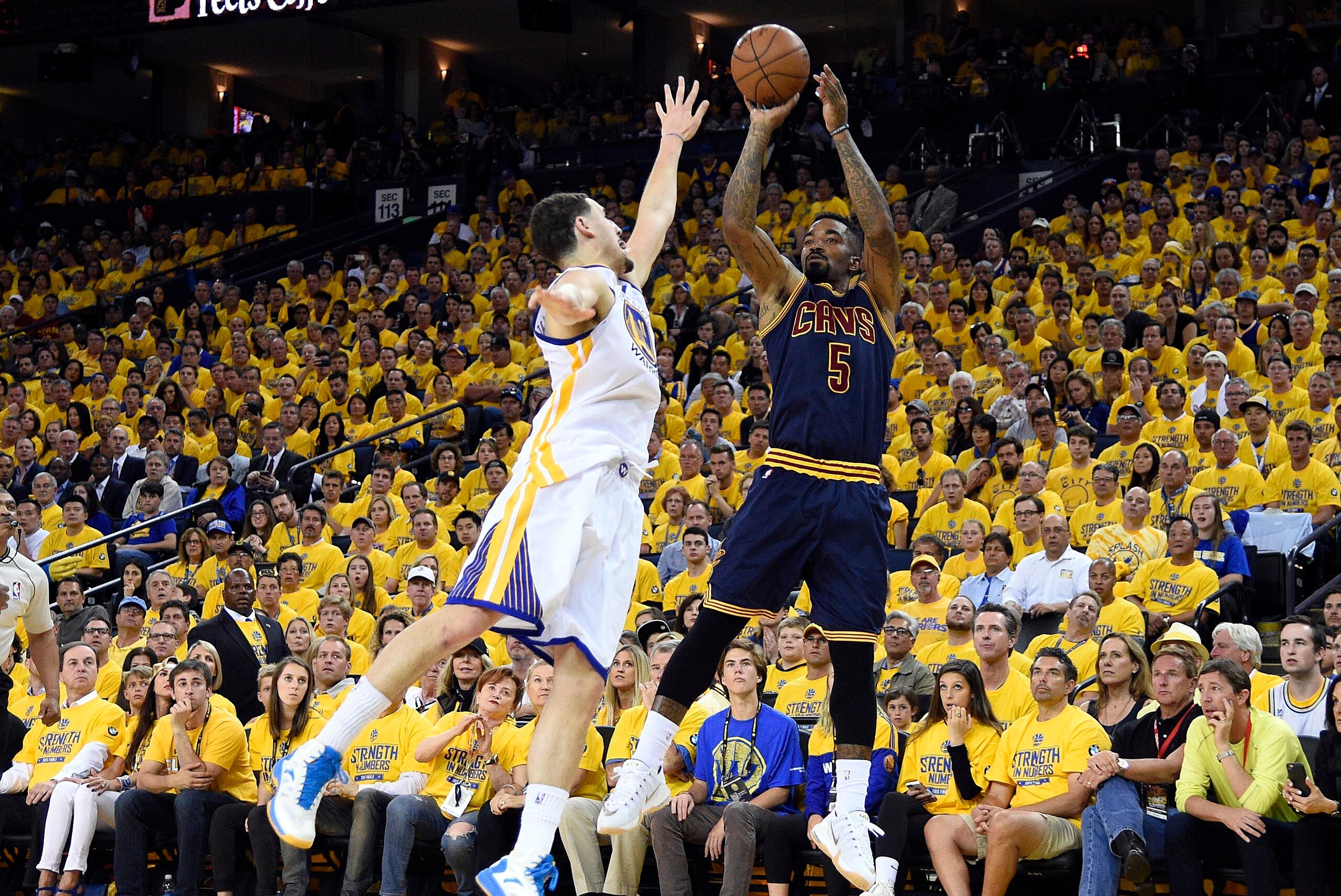 Jun 7, 2015; Oakland, CA, USA; Cleveland Cavaliers guard J.R. Smith (5) shoots the ball over Golden State Warriors guard Klay Thompson (11) during the fourth quarter in game two of the NBA Finals at Oracle Arena. Mandatory Credit: Kyle Terada-USA TODAY Sp